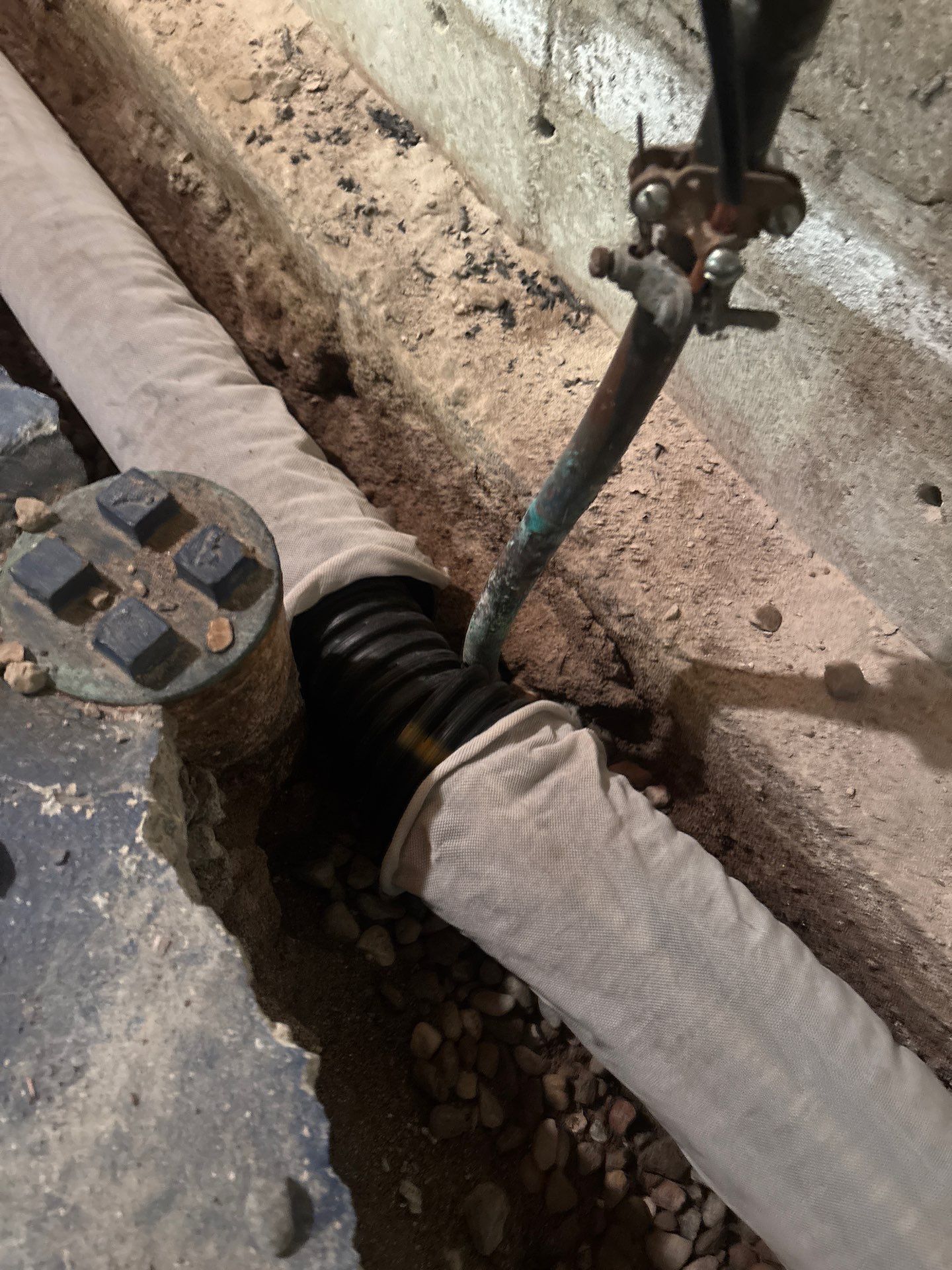 Interior Drain Tile & Buried Discharge in South Minneapolis by Waterproofing Northeast