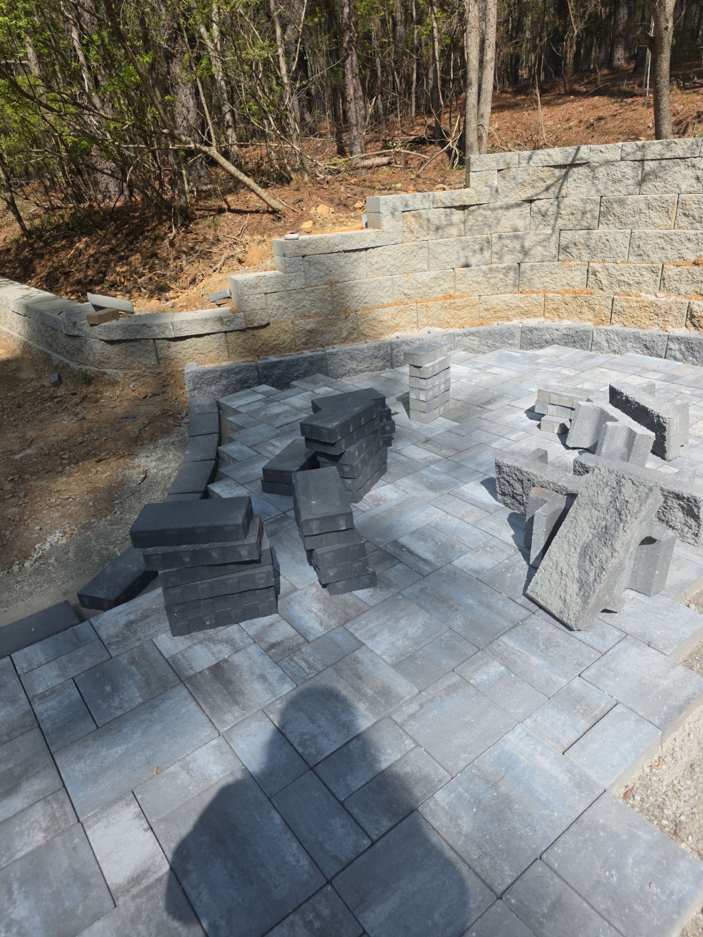 Pittsboro Outdoor Living Transformation – Retaining Wall, Paver Patio & Elevated Deck by Elite Remodeling and Design LLC