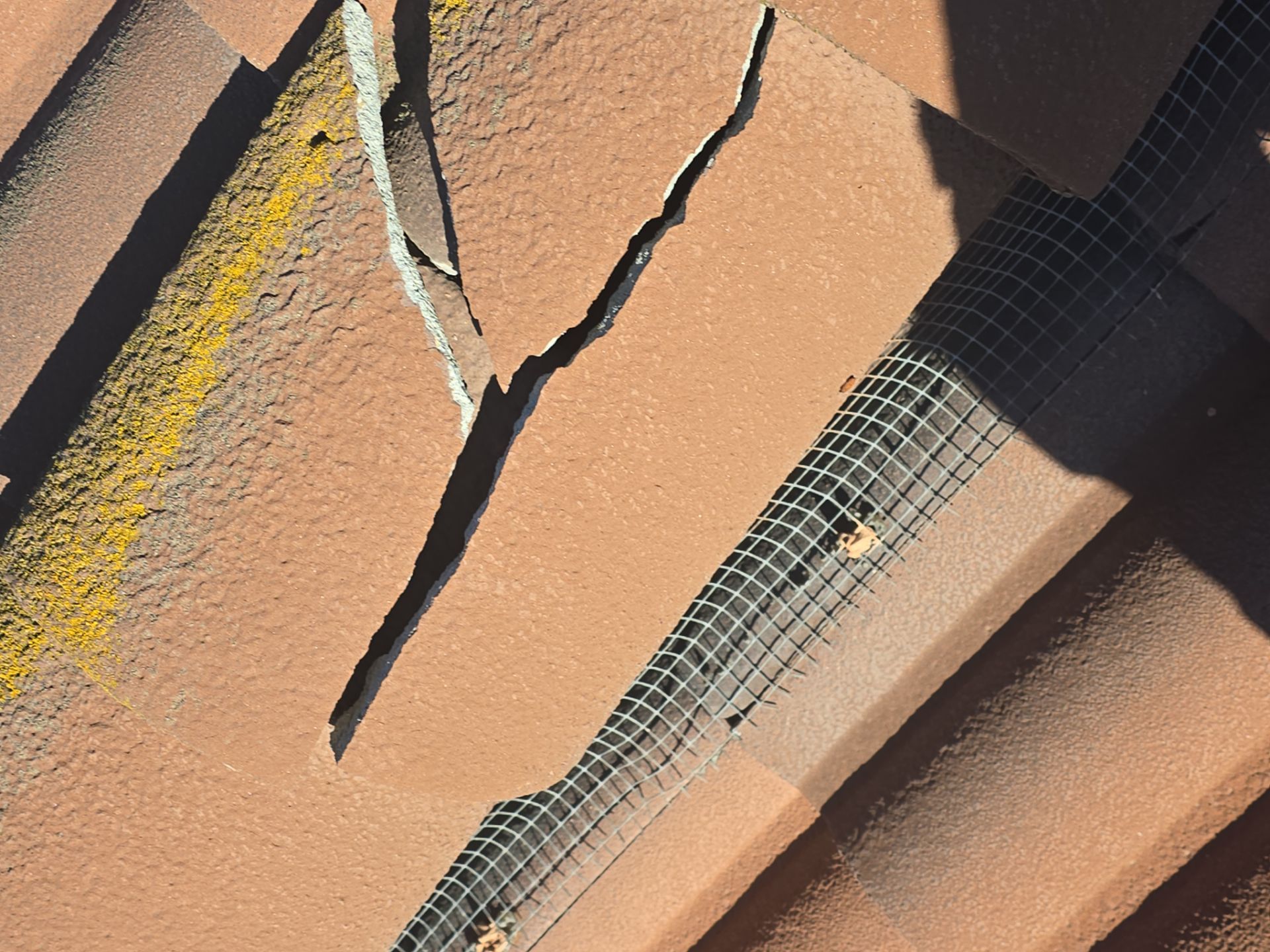 Tile Roof repair by Grandmark Service Company