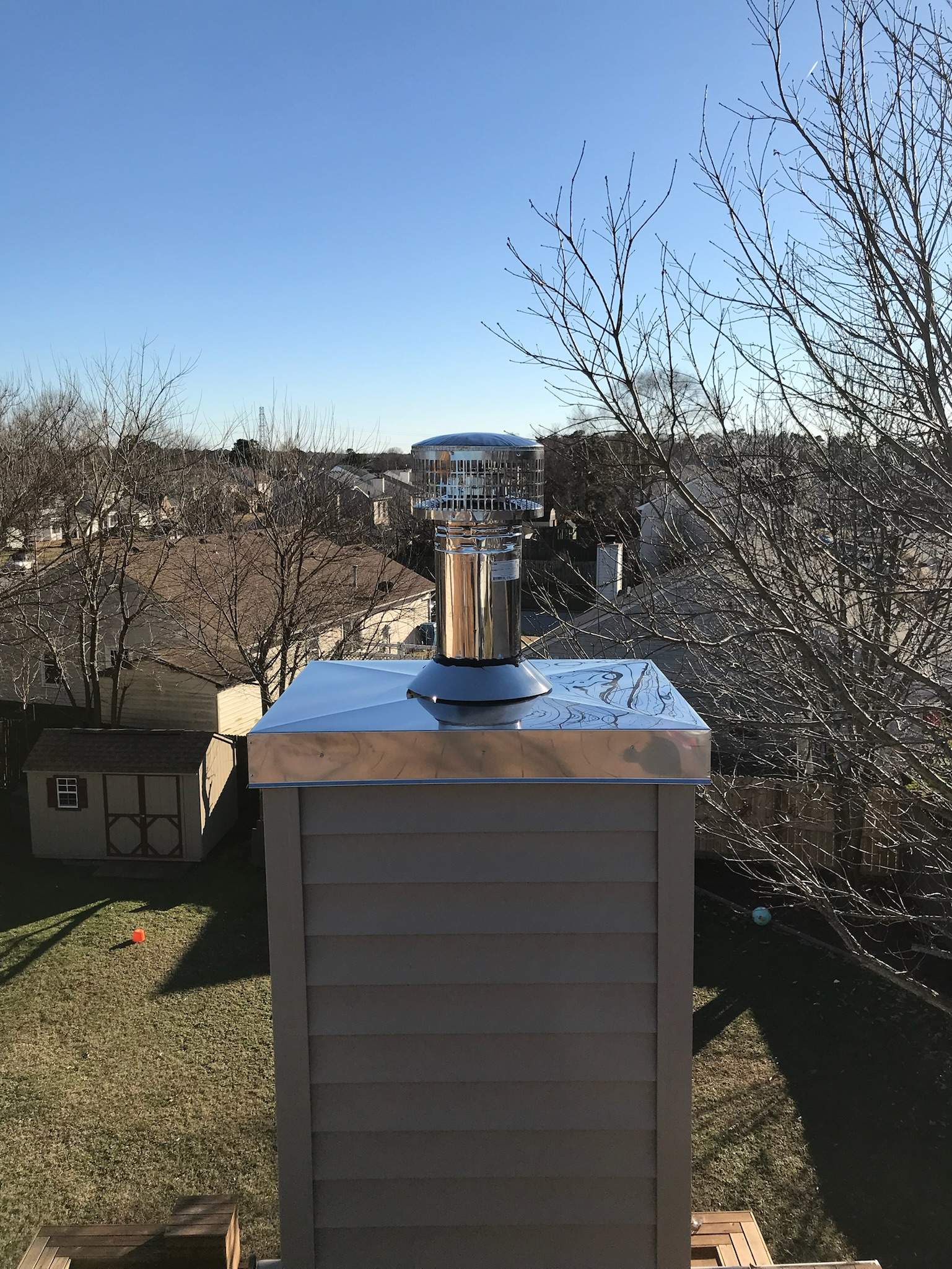 Stainless Chase cover, cap, and pipe by Premier Chimney and Roofing