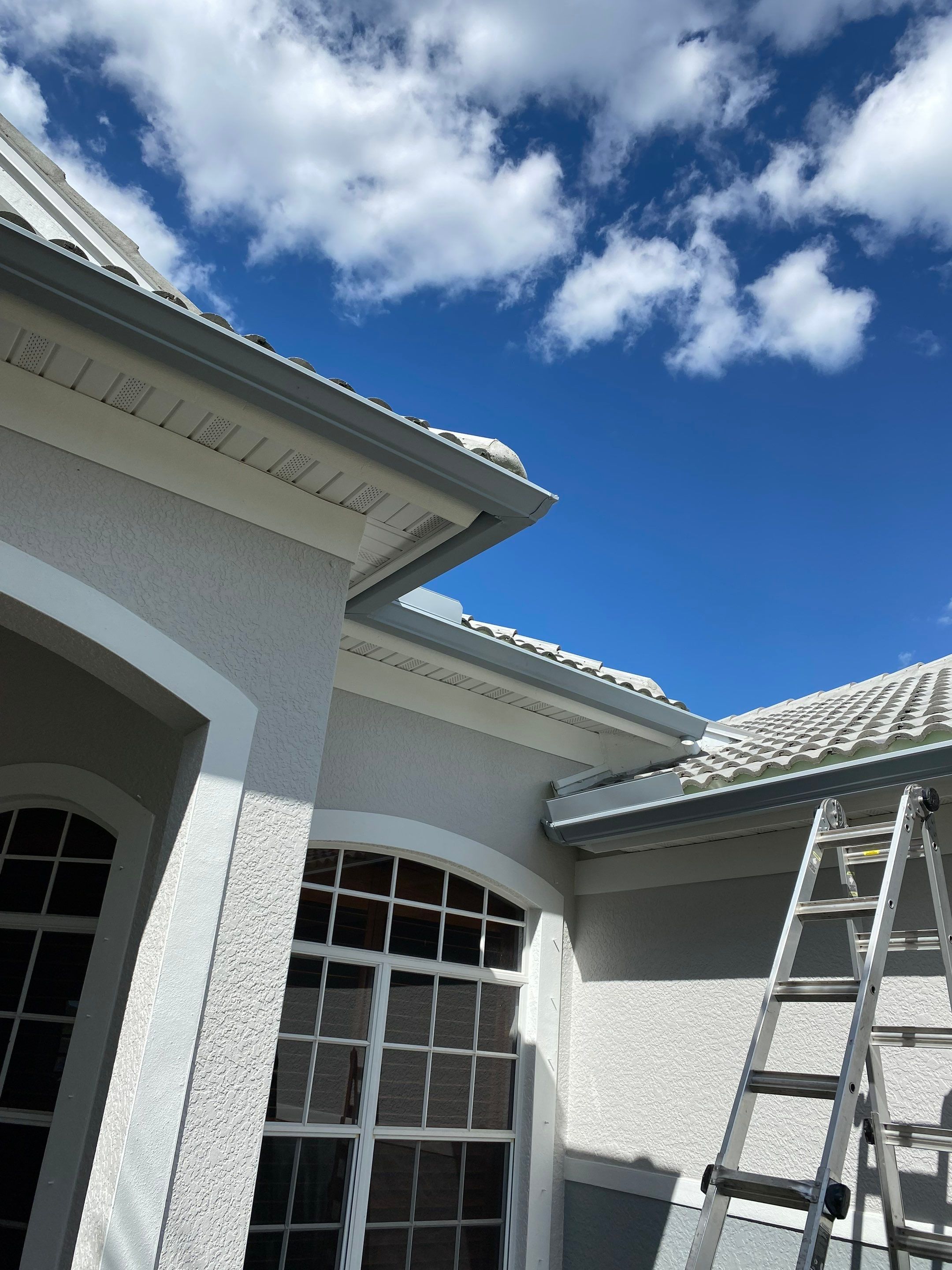 6-inch K-style Seamless Gutters and Splash Guard in Grey Color in Naples FL by Gutter Professors