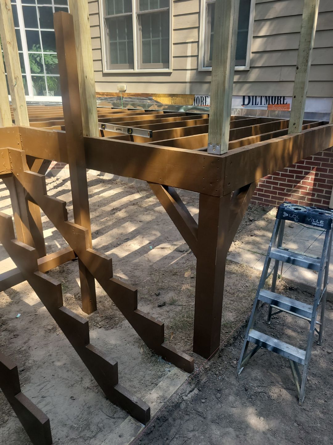 Fuquay-Varina Outdoor Upgrade – Composite Deck & Paved Landing by Elite Remodeling and Design LLC
