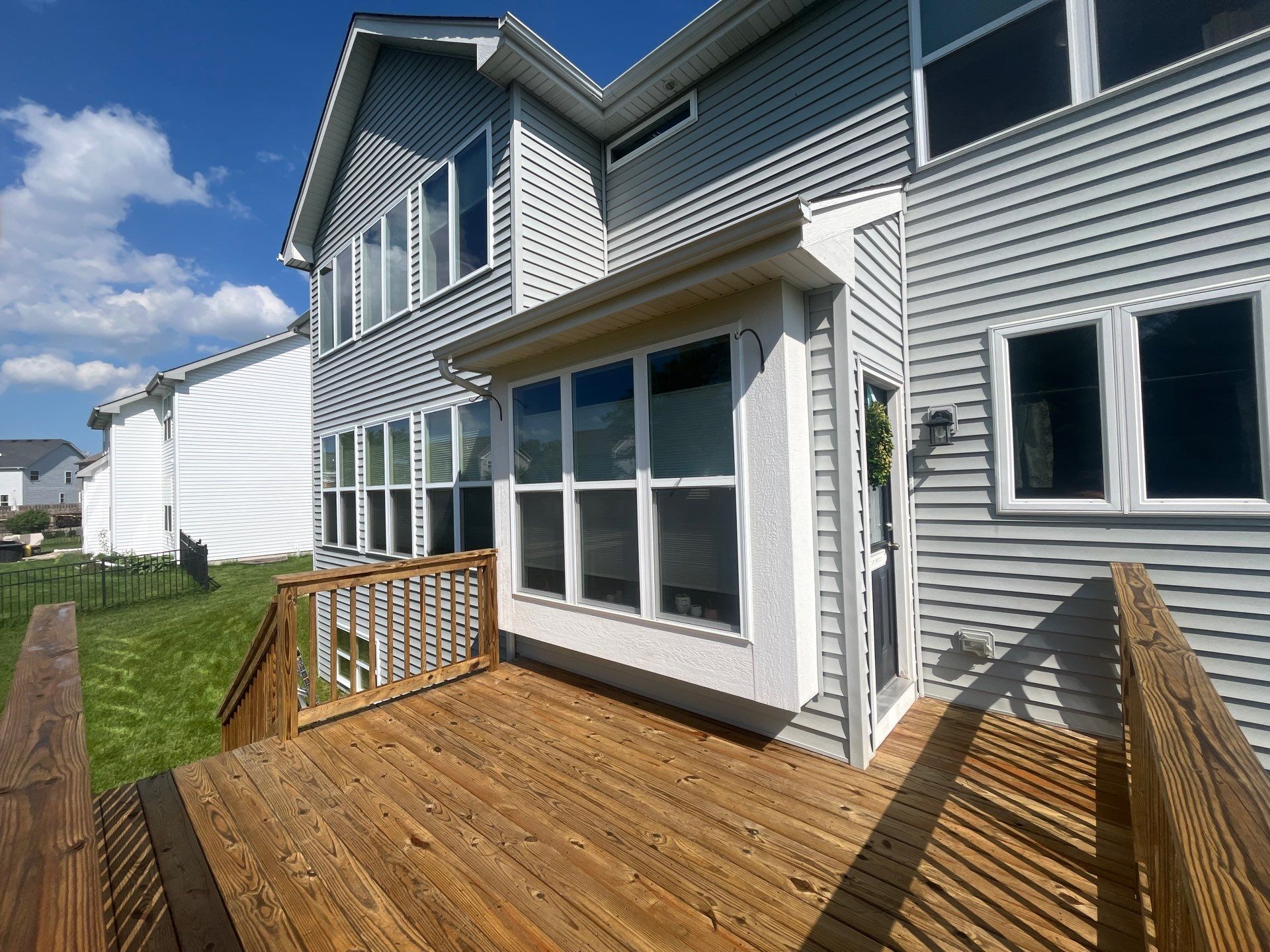 wood deck cleaning and staining by Northern Power Washing LLC.