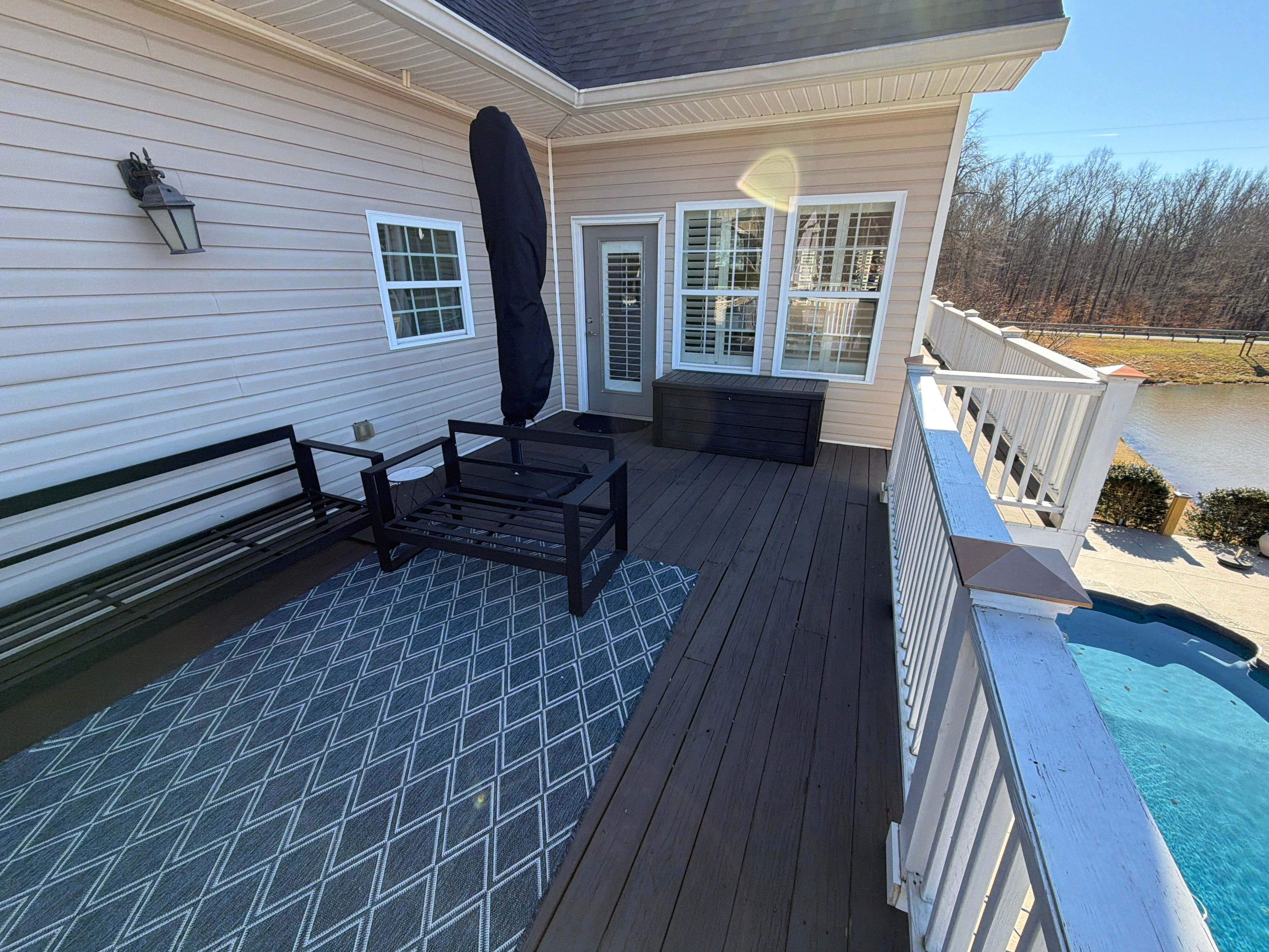 Cumming, GA Lake House Deck Resurface and Extension using Pressure Treated Pine and Skyline Cable Railing by Nelson Exteriors 