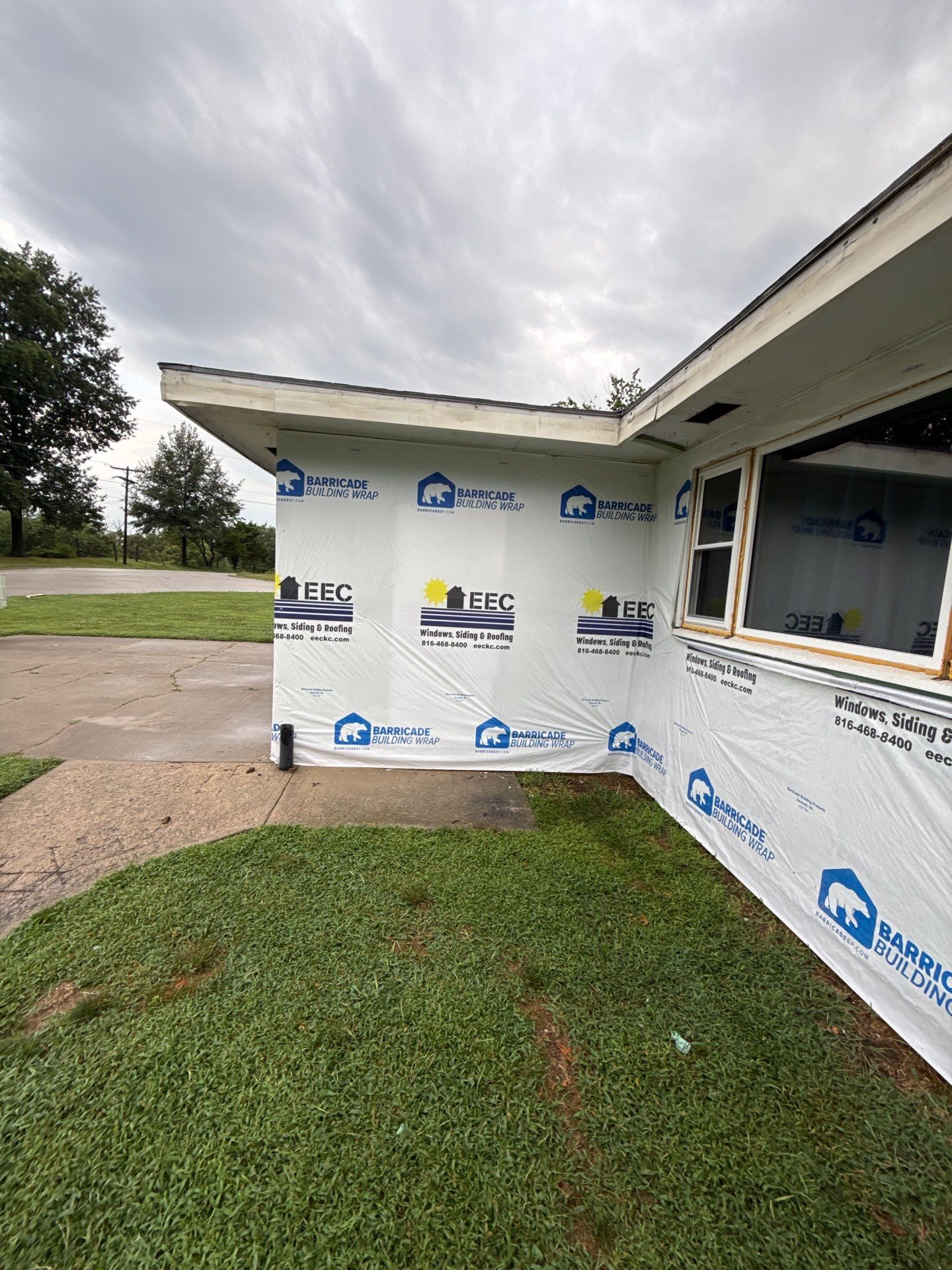 Indigo Board and Batten Siding and Window Replacement in Smithville by EEC Windows, Siding & Roofing