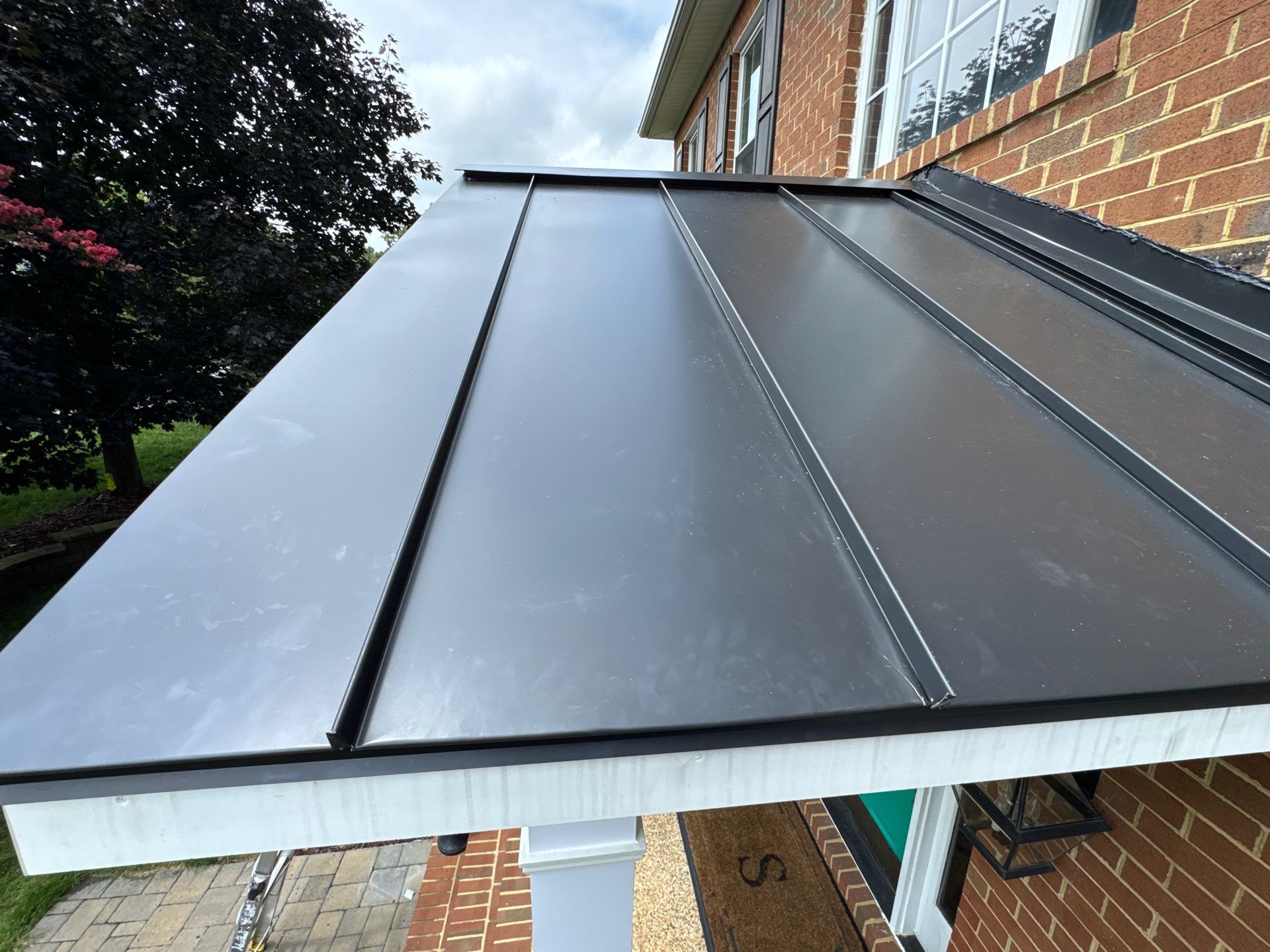 Standing Seam Metal Porch Roof Installation in Mechanicsville, VA by Cade Construction