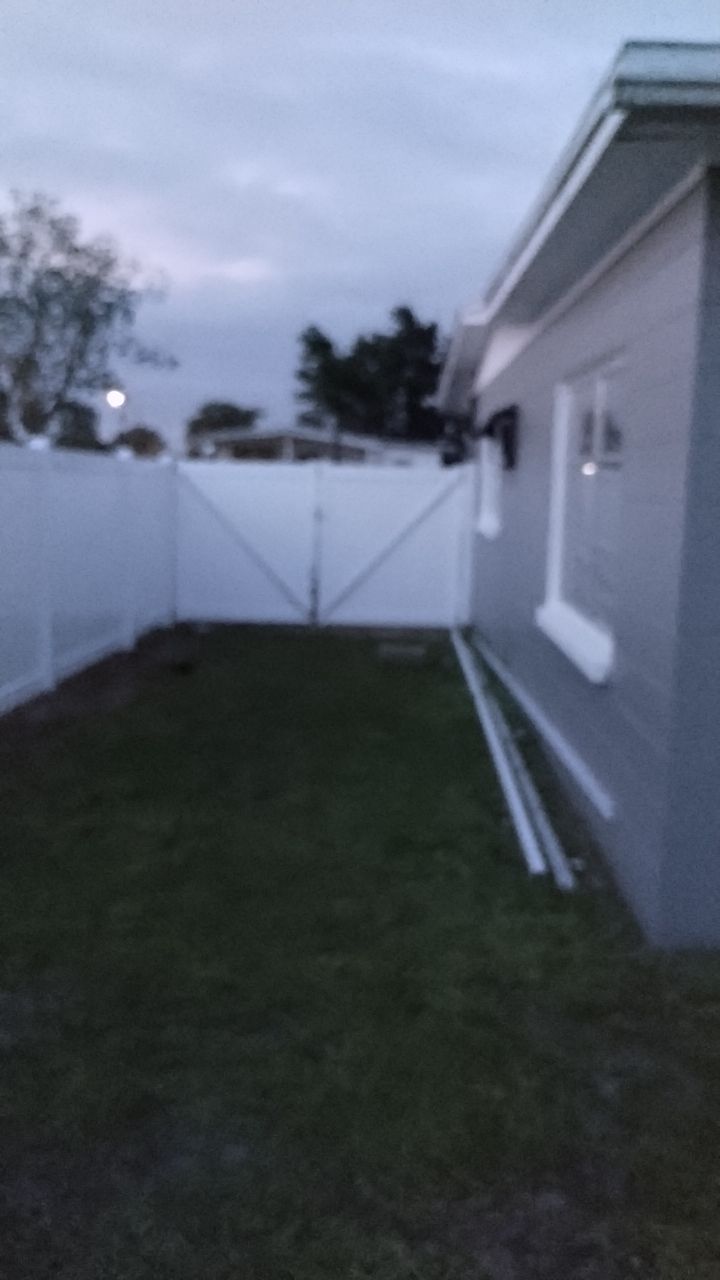 White Vinyl Privacy Fence Installation In North Port, FL by Asap fence and gates, LLC