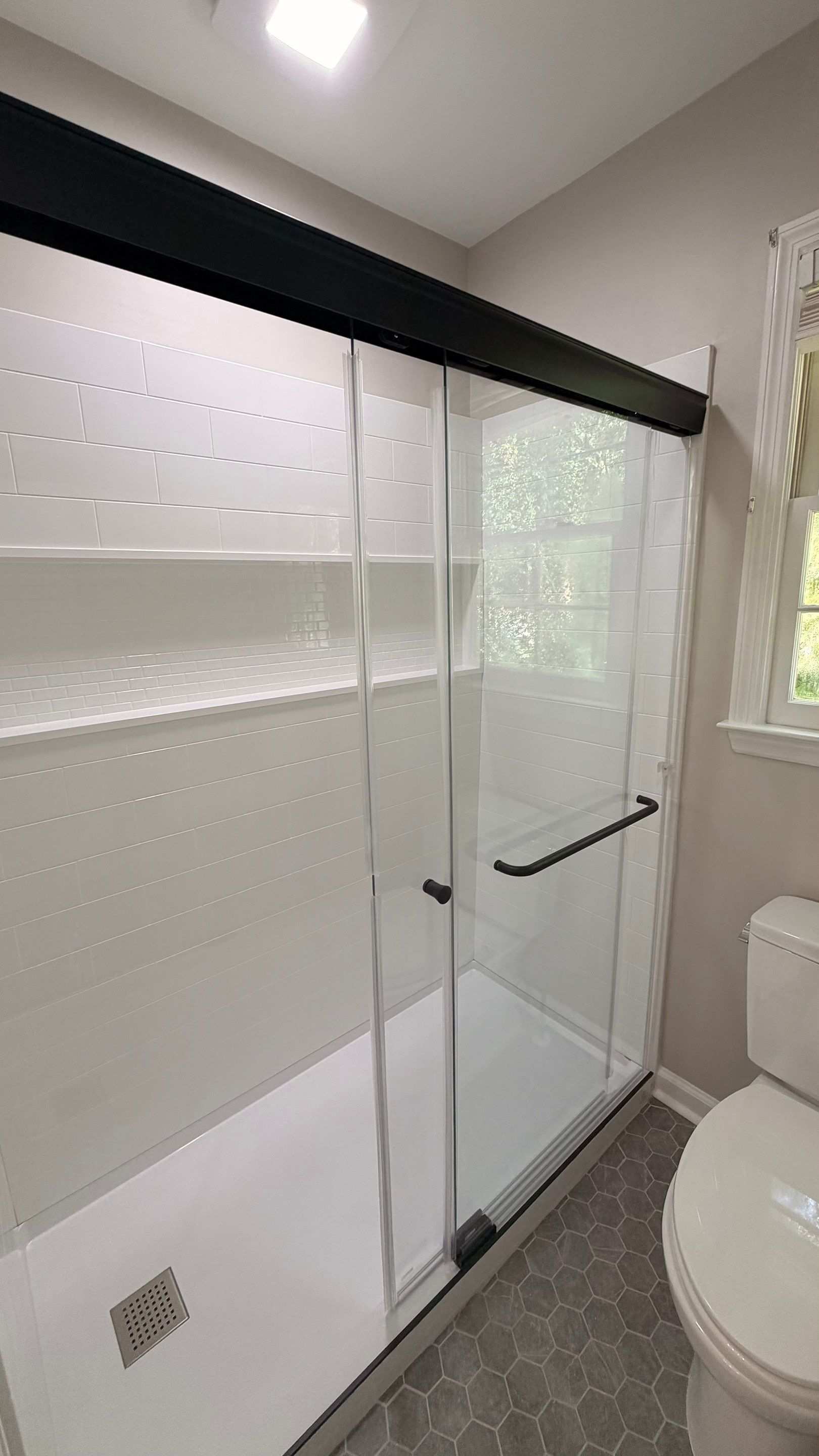 Modern Bathroom Remodel With Quartz Countertops and Hexagonal Tile in Acworth by Swift Home Renovations