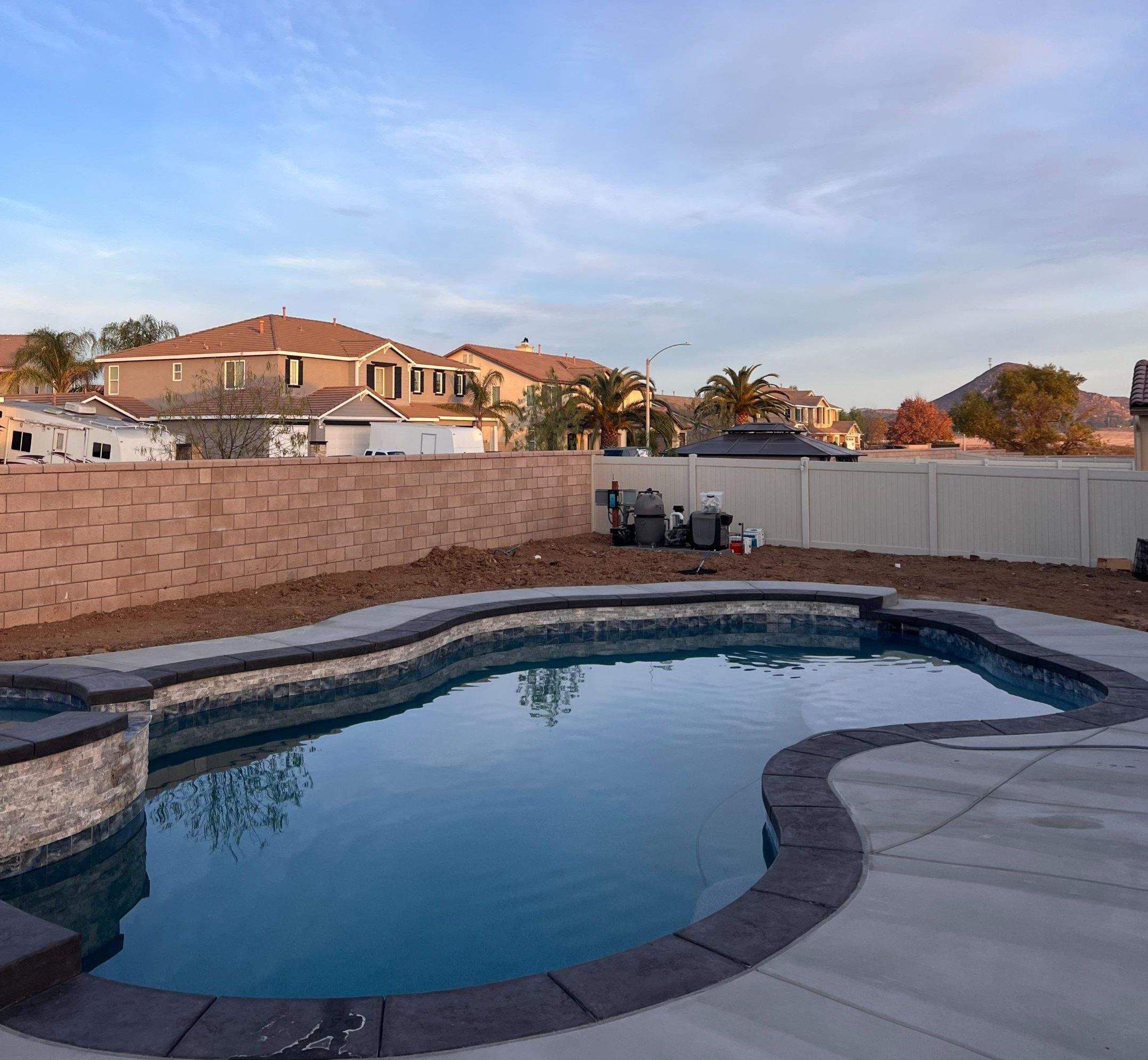 Freeform pool and spa pip coping by Premier Pools and Spas Temecula