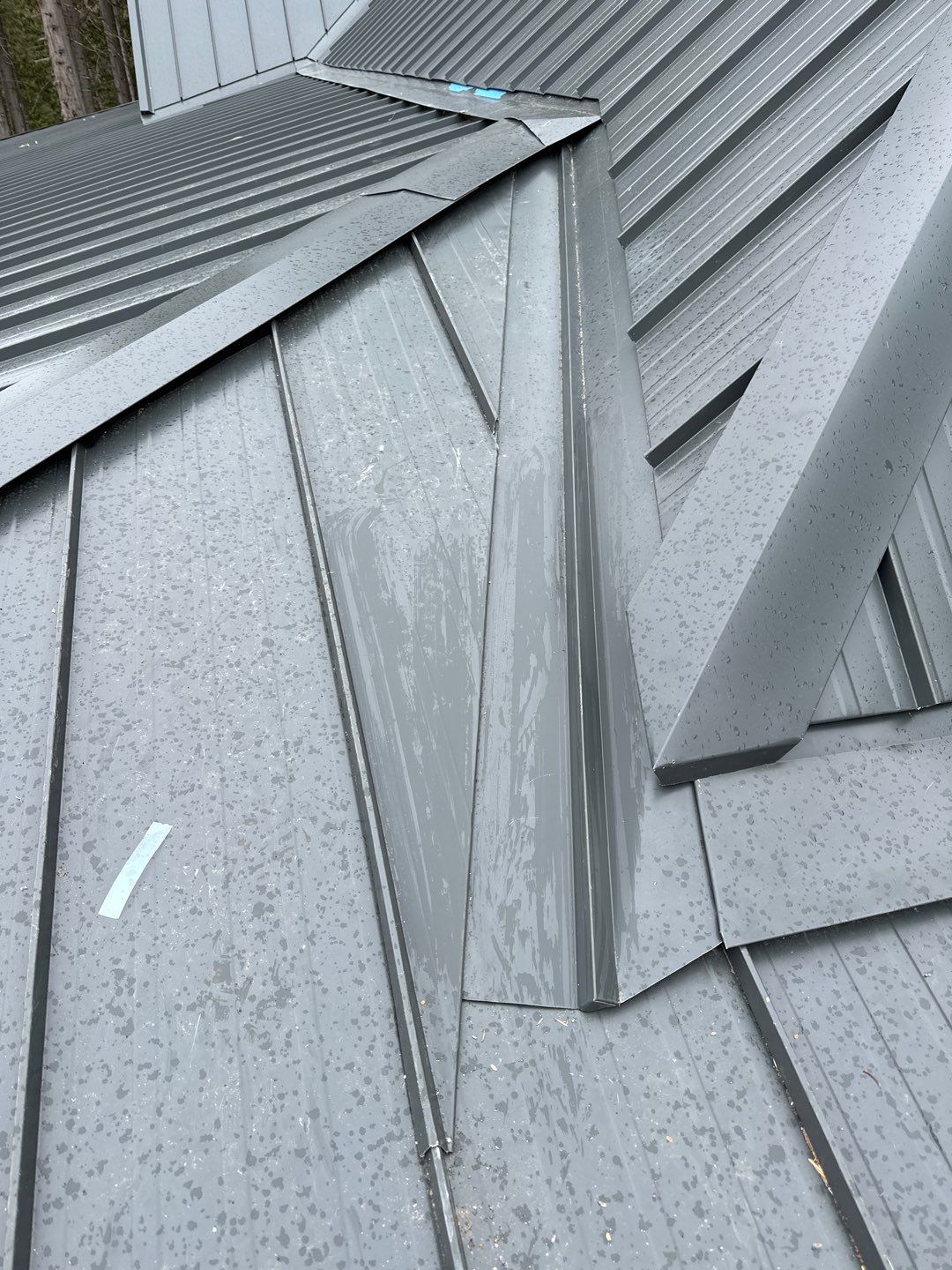 Residential Roofing Installation using 12" Prolok metal by Top Notch Roofing Inc