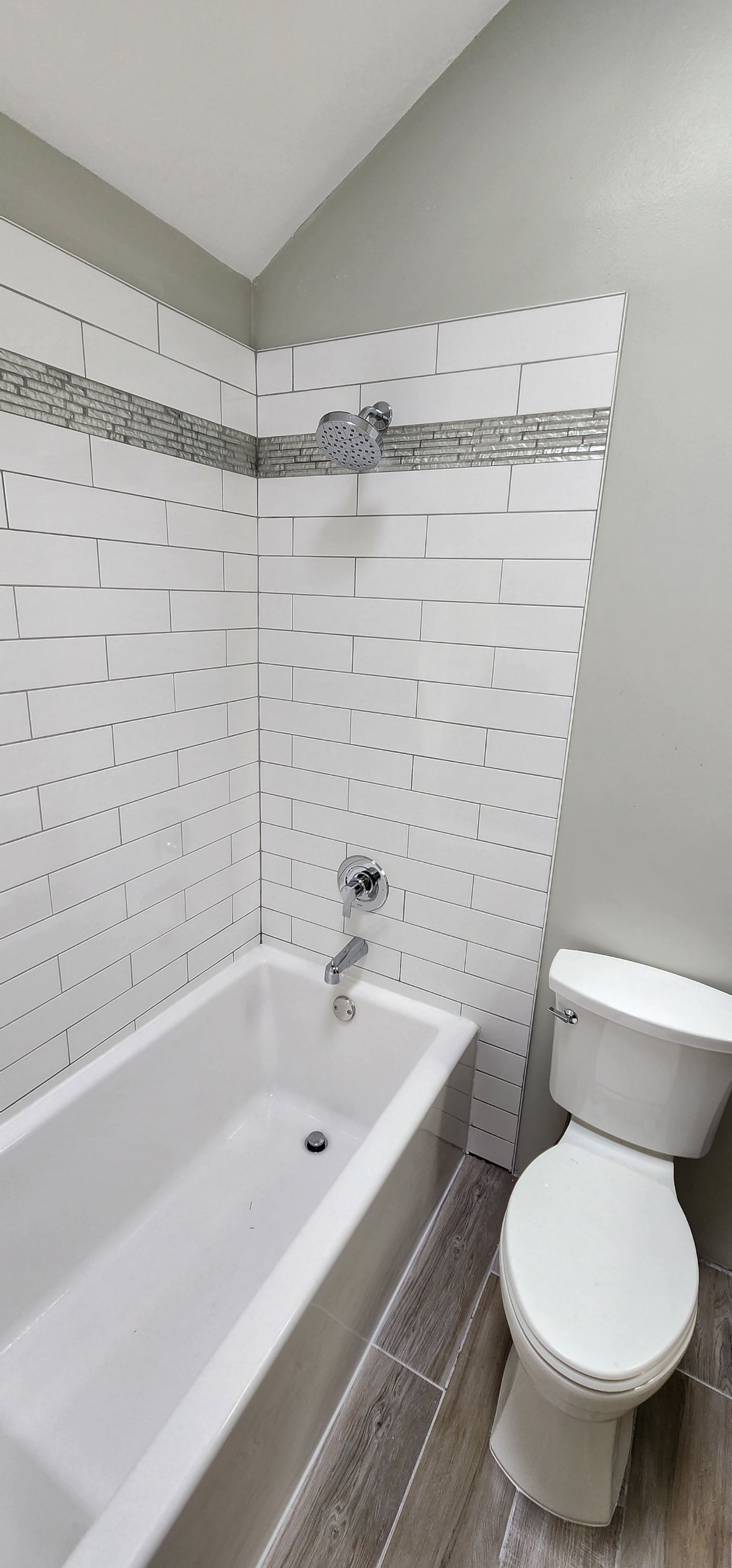 Beautiful tile tub surround and tile floors! Customer started, TSC finished by The Shower Company