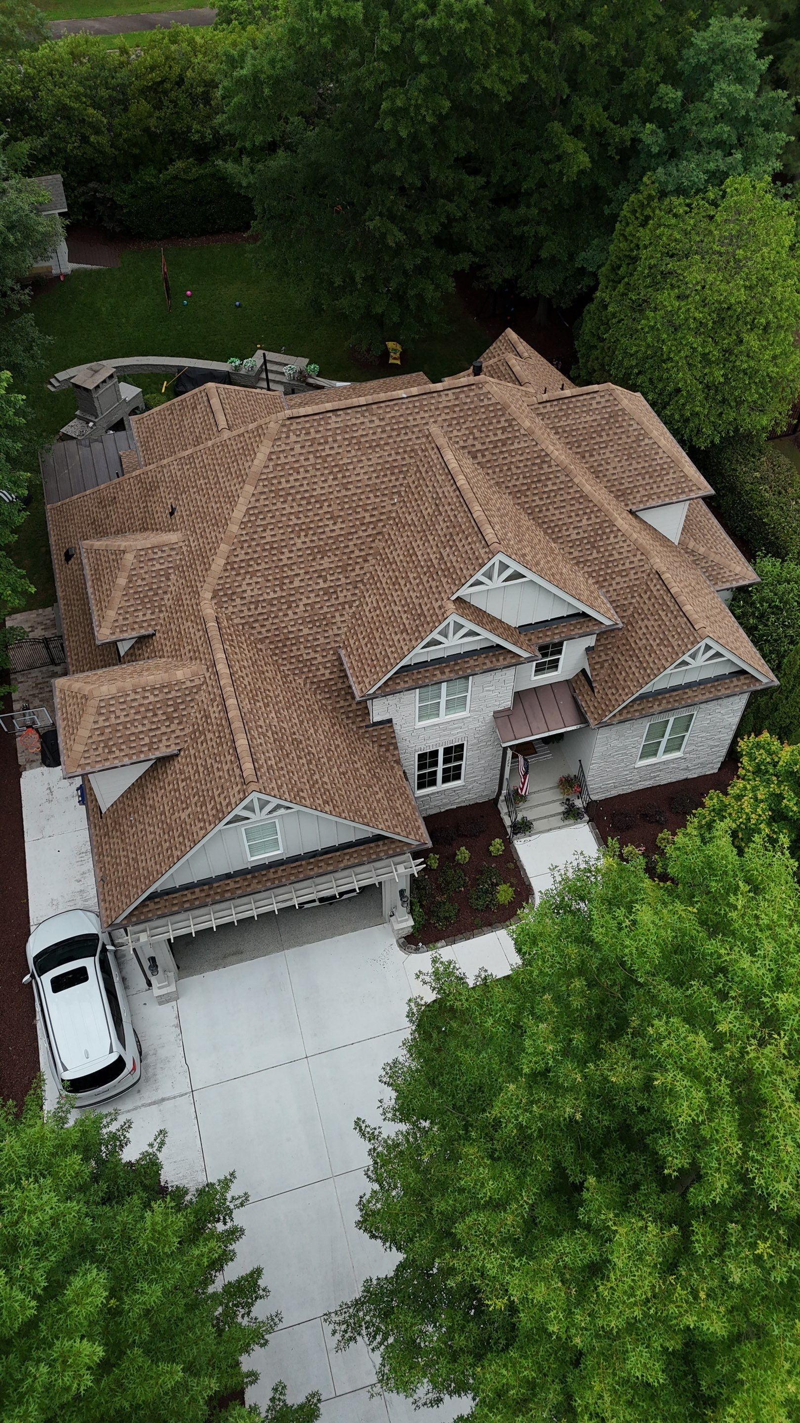 Roof Replacement - GAF Timberline HDZ Shakewood - 6” coppertone seamless gutters by Pro Performance Roofing