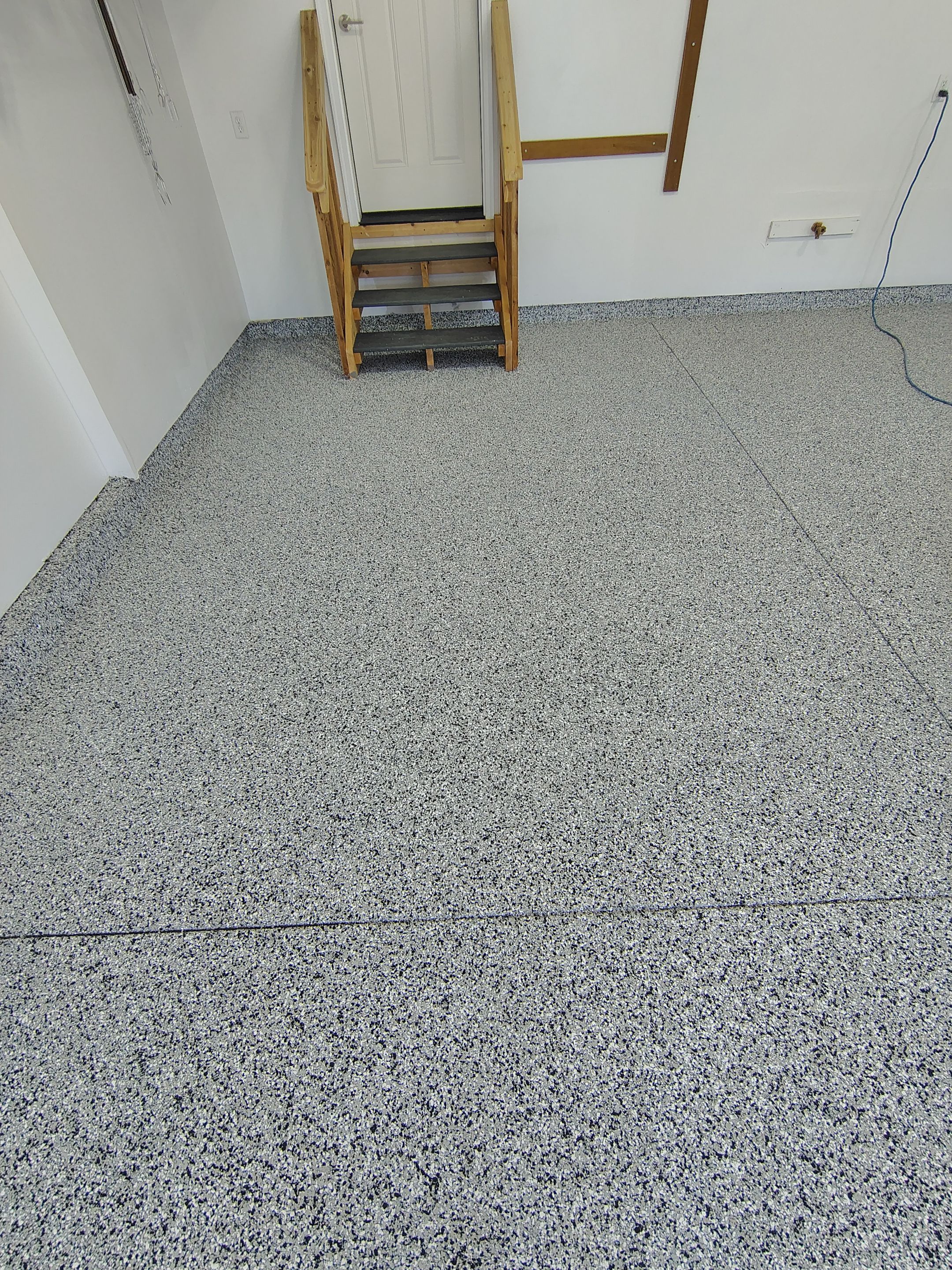 Decorative Flake Garage Floor Coating Installation in Tea, South Dakota by Select Painting, Coatings & Garage Cabinets