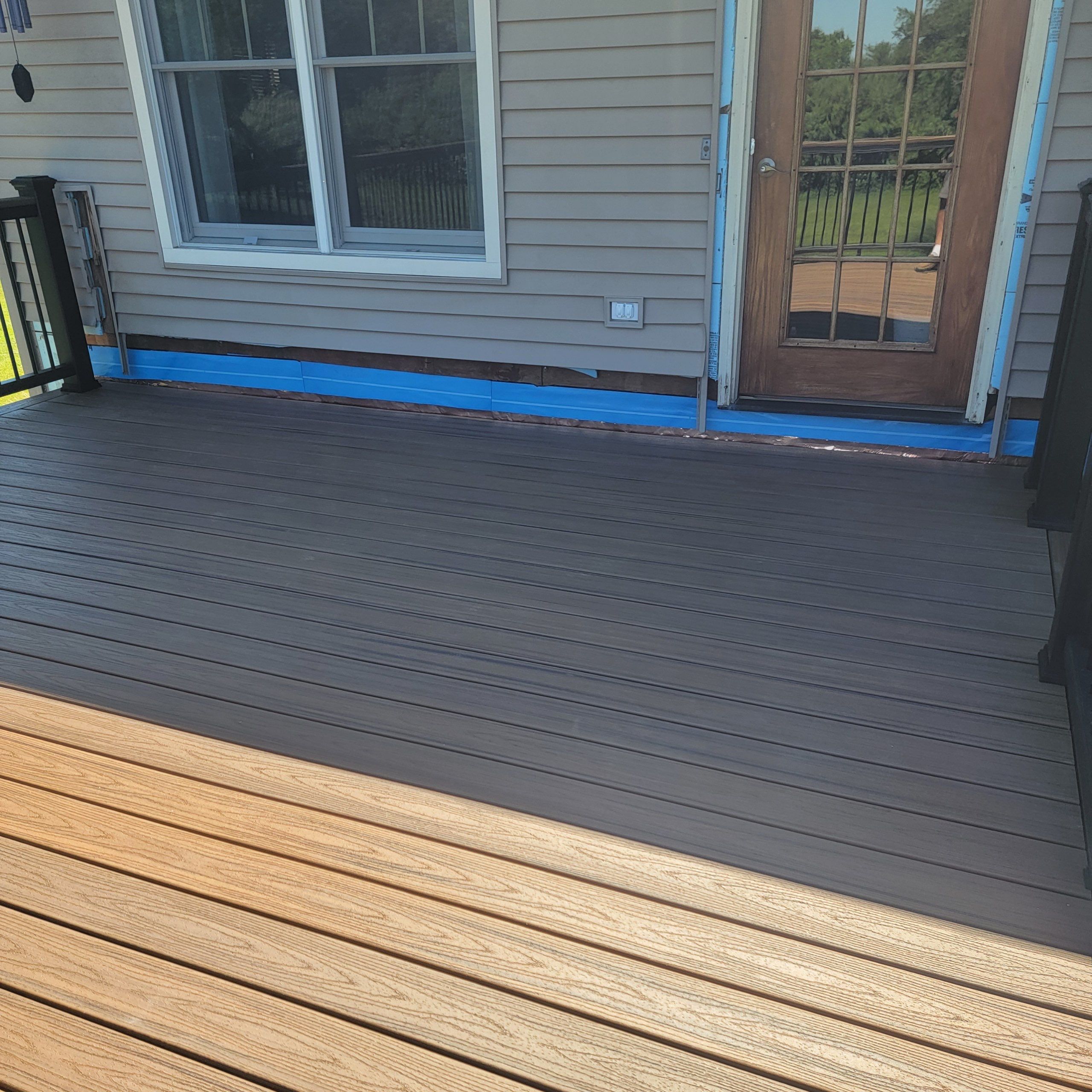 Deck Replacement using Trex Tropical Havana Gold and matching transcend cocktail railing.  by DiGiorgi Roofing and Siding Inc