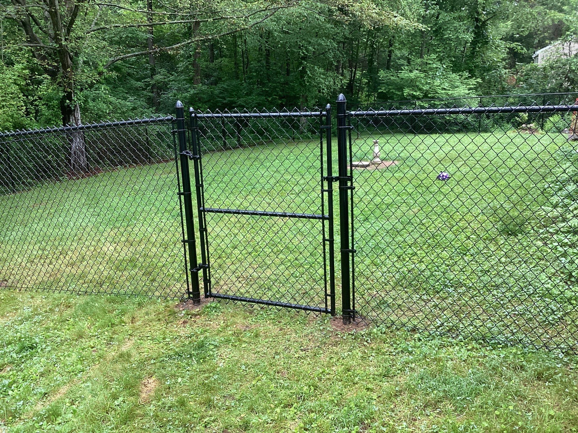 New Black Chain link fence with matching gate.  by DiGiorgi Roofing and Siding Inc