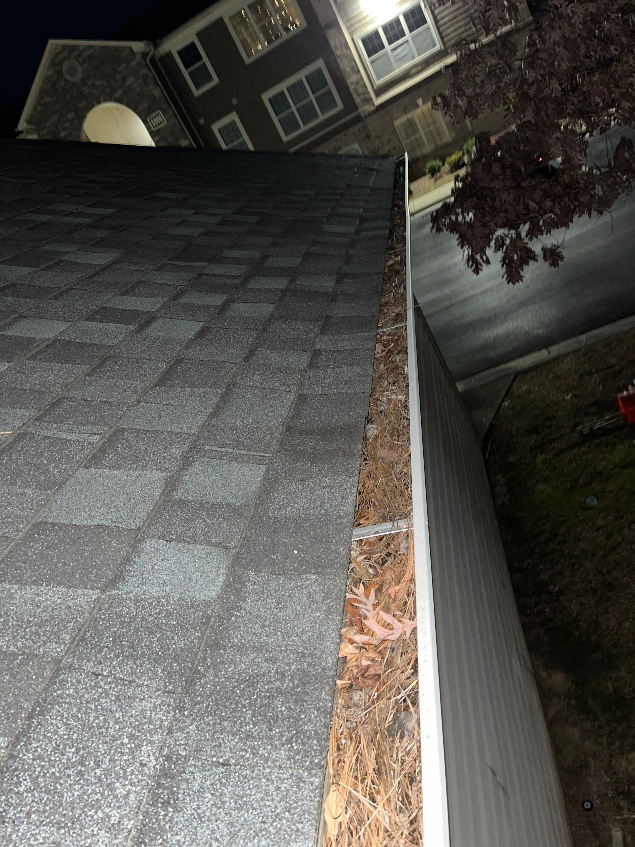 Commercial gutter cleaning Sandhills & Aberdeen, NC before photo with filled gutters
