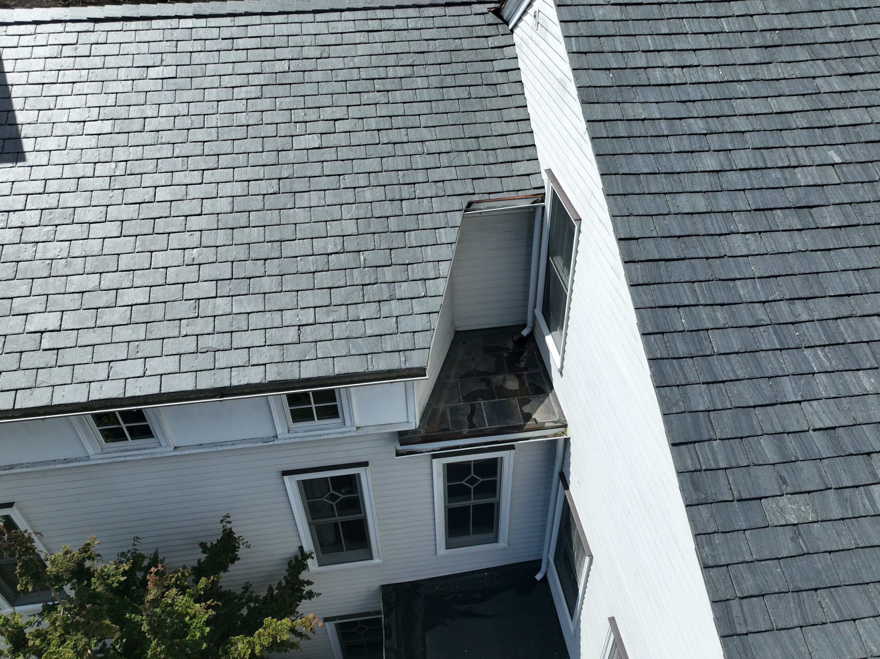 Residential Roofing Installation using Vermont Slate by A Plus Exterior