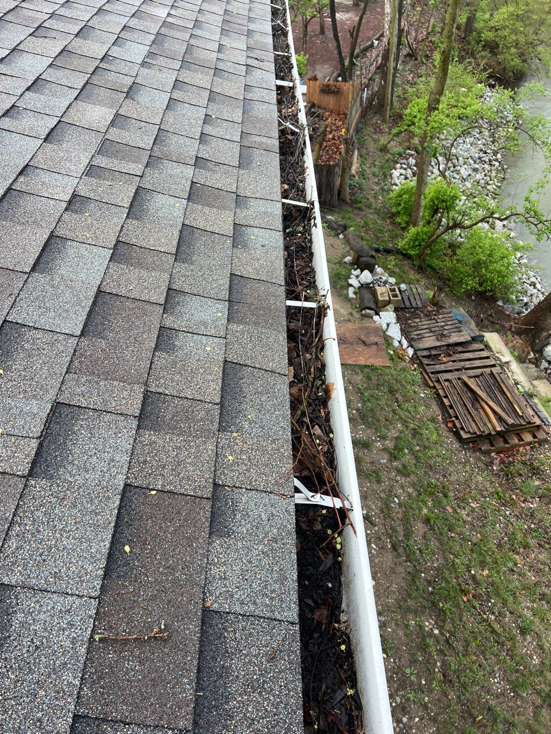Commercial gutter cleaning Indiana before photo with filled gutters