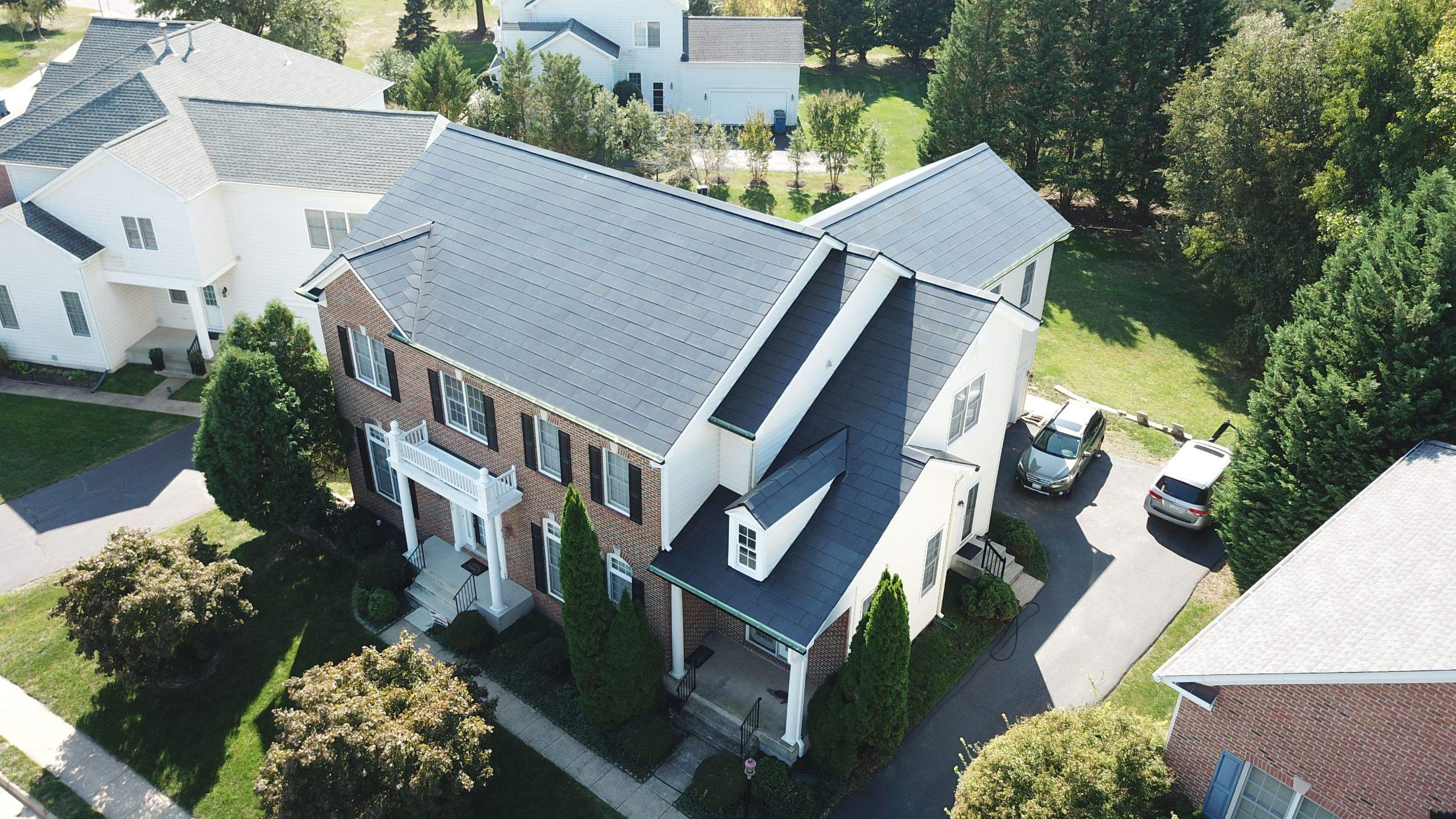Tesla Solar Roof Replacement using Tesla Solar Roof V3 tiles by American Home Contractors