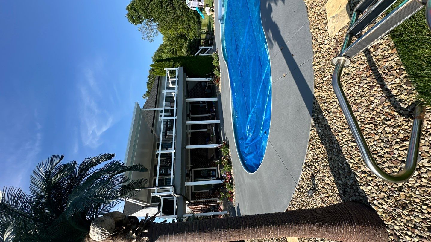 Twilight Pool Deck / Patio Project in Beaver falls by Floors in a Day, Inc