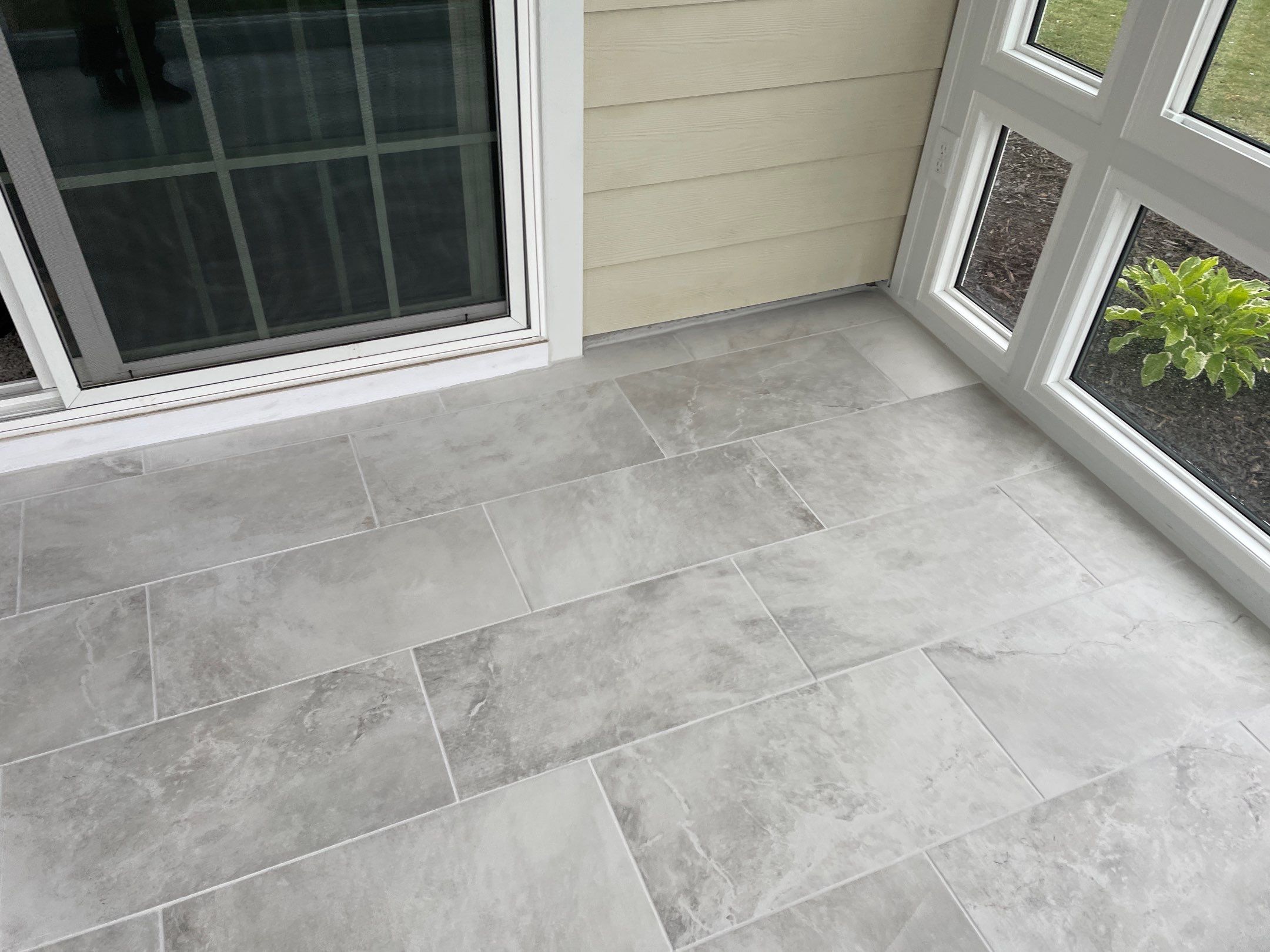 Amazing Tile Transformation After Enclosed Windows Added to Sunroom by Footprints Floors of Coastal Carolina