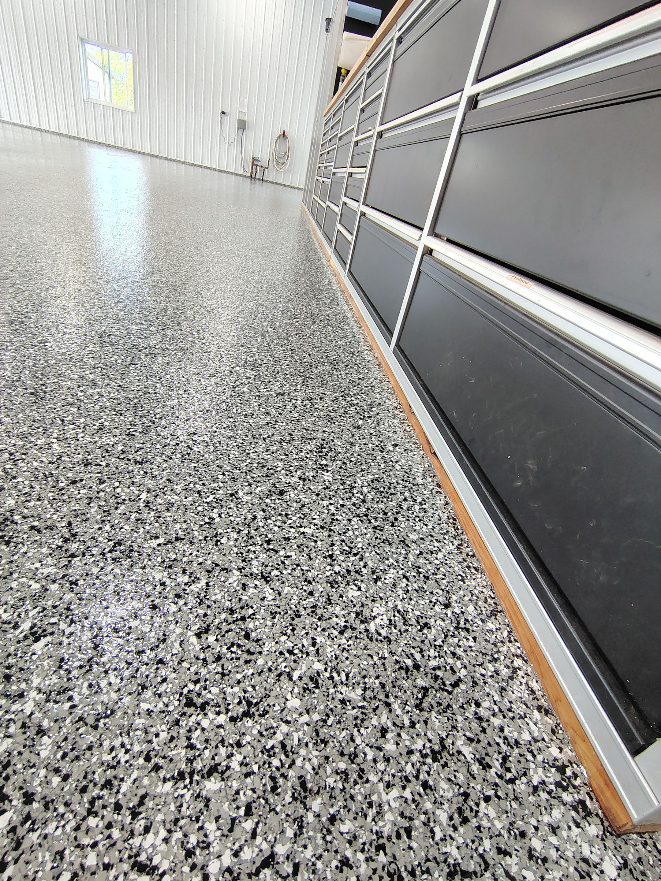 Multi-Stage Concrete Floor Coating for Egan Shop and RV Storage by Select Painting, Coatings & Garage Cabinets