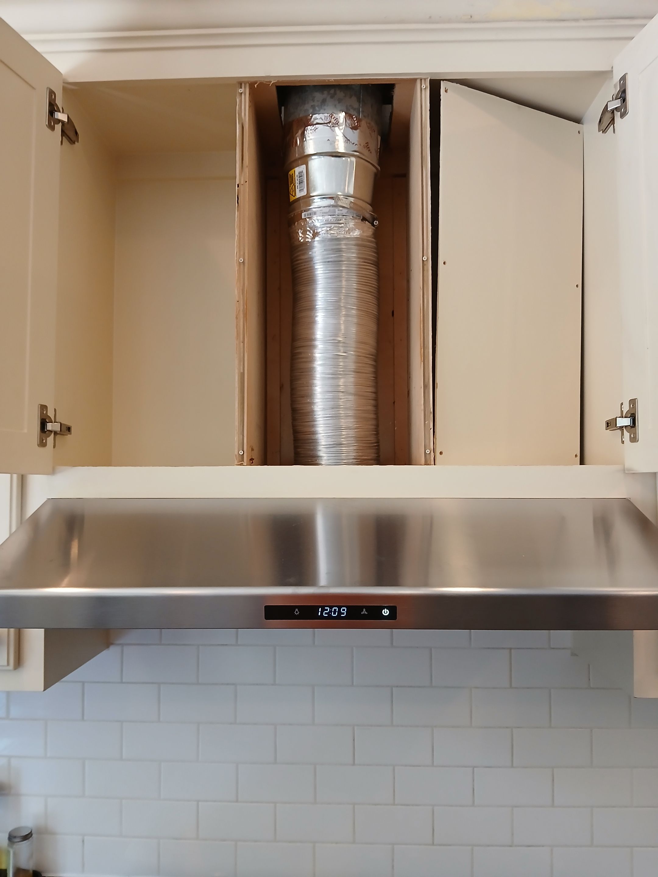 Under-Cabinet Range Hood Installation with Vent Ducting in Austin by RejuveNate Renovations LLC
