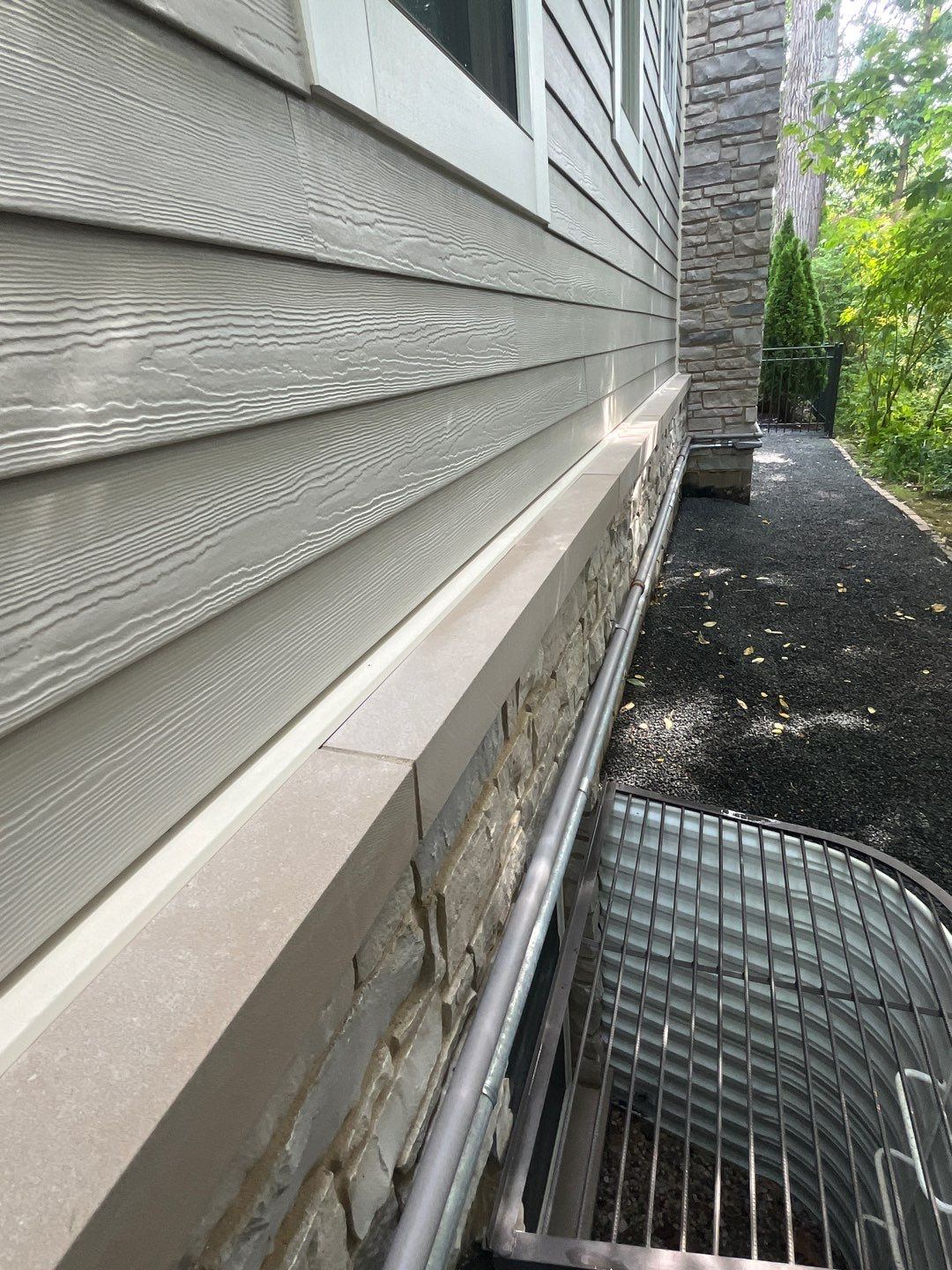 Hardie Board House & Detached Garage Soft Washing by Northern Power Washing LLC.