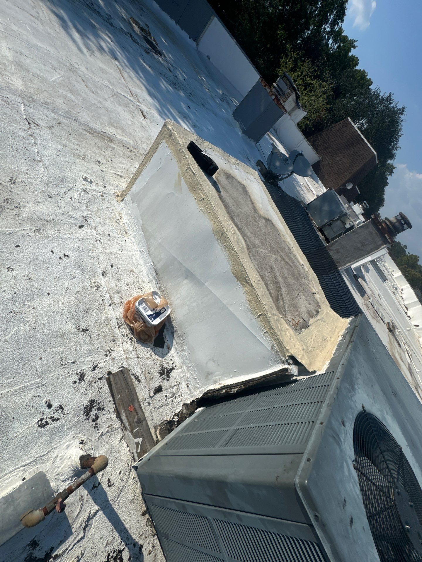 Waterproofing AC Curb covered courtyard on a flat Roof by Associates Roofing Unlimited