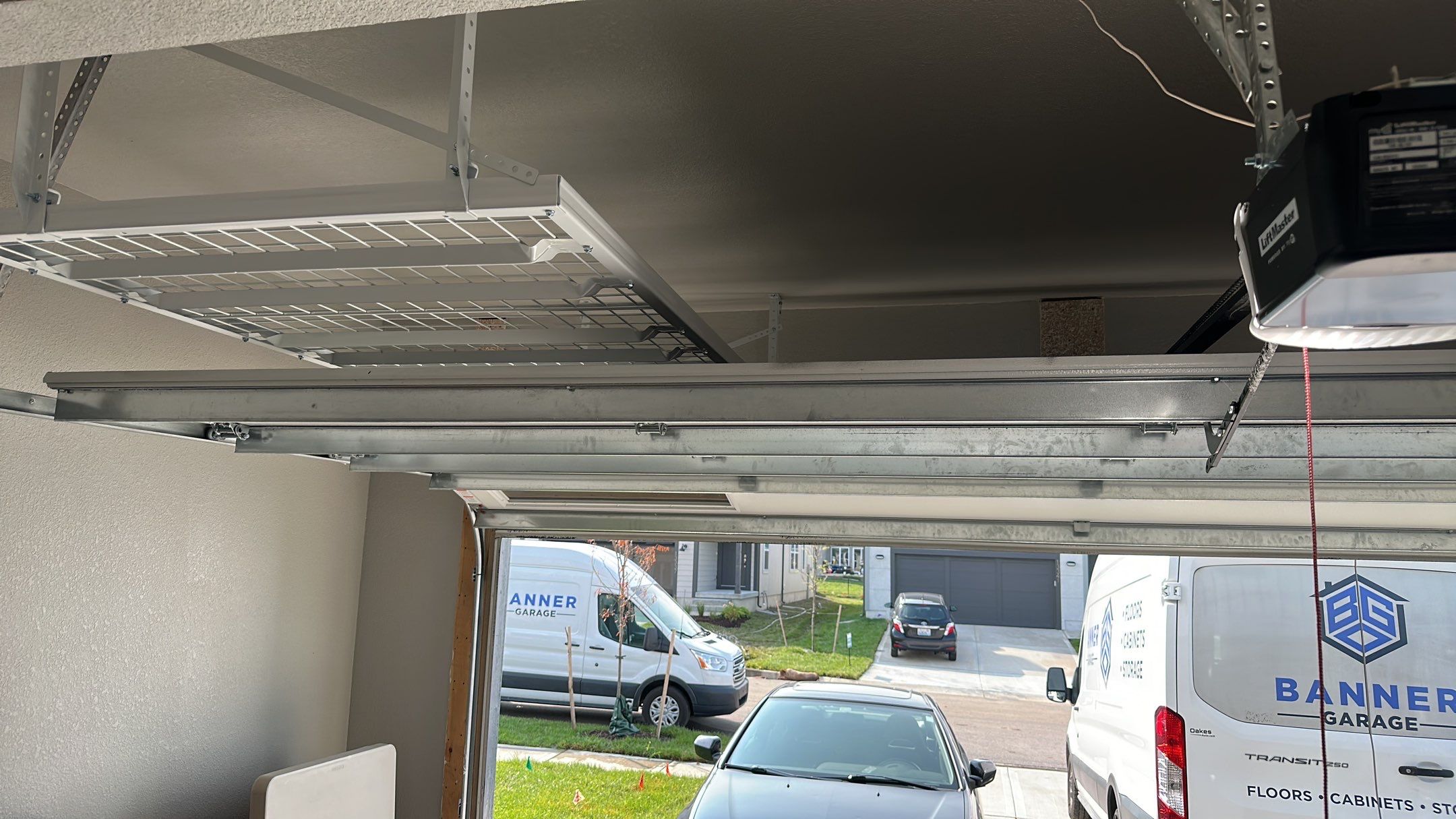 John H. maximized his storage with overhead racks and wall shelves by Banner Garage