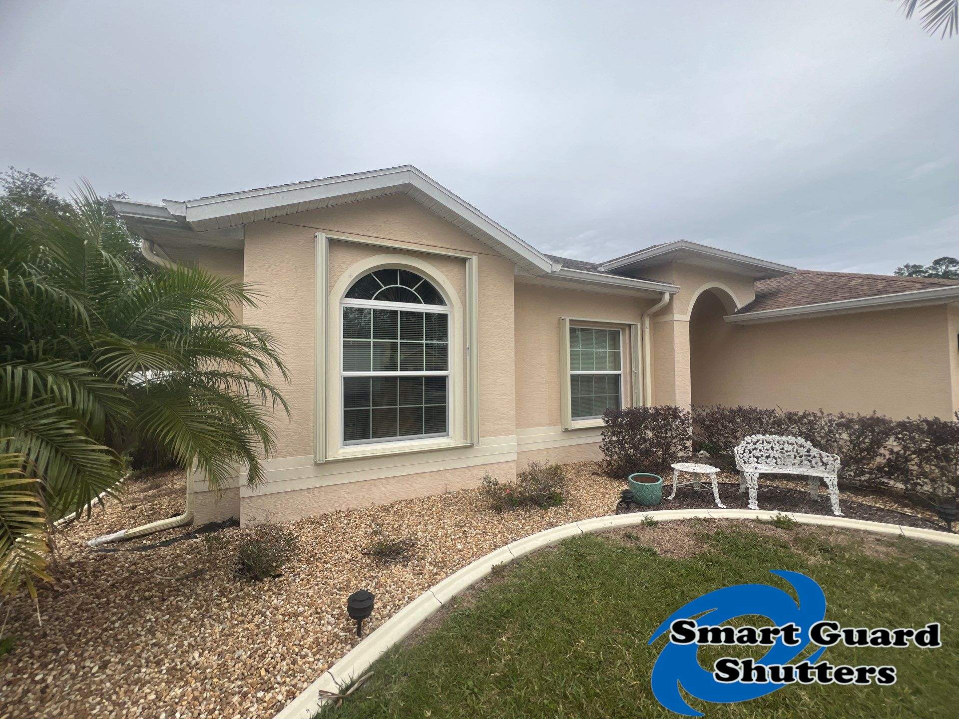 Accordion Shutters in Ivory by Smart Guard Shutters