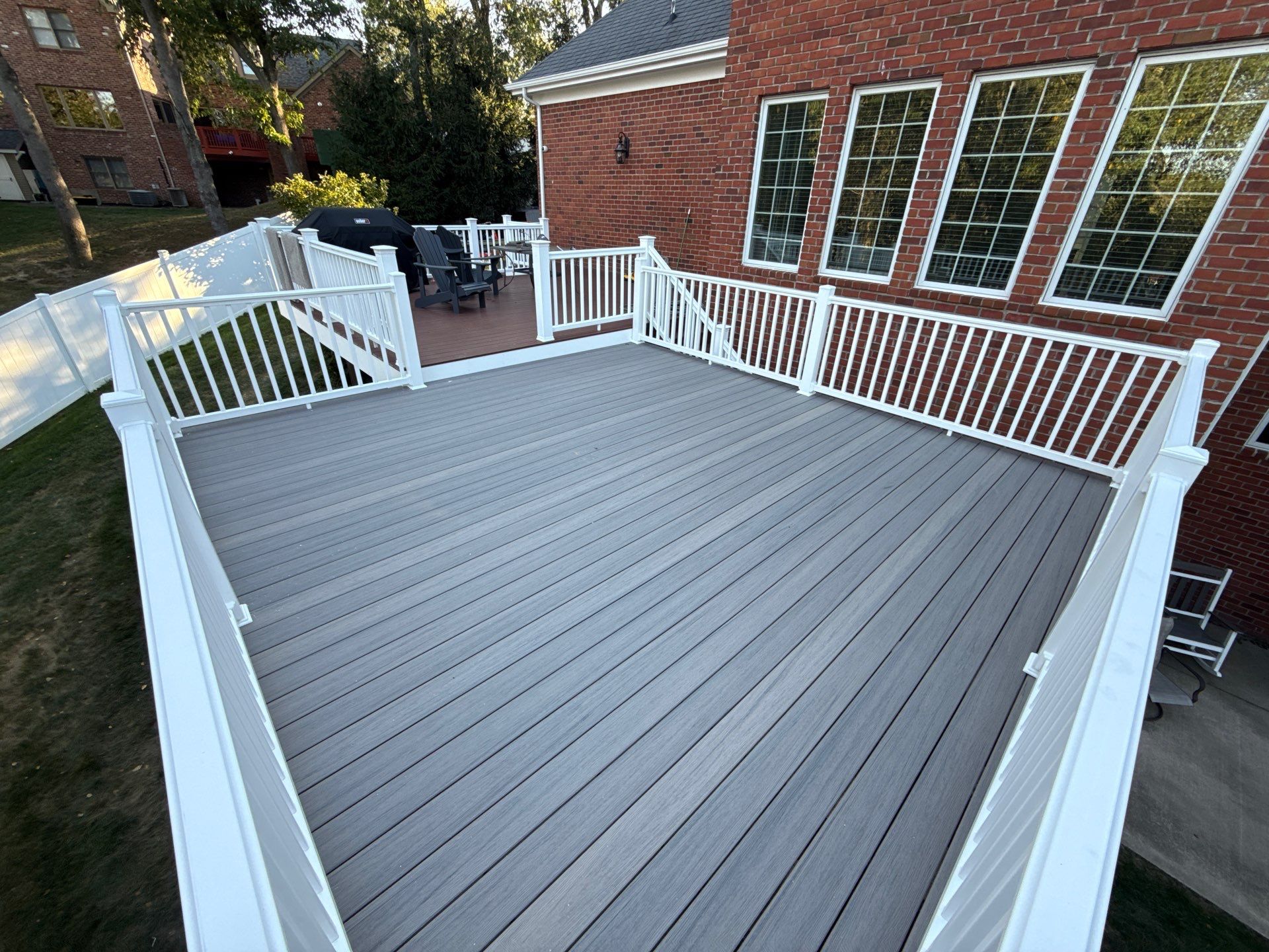 Deck extension  by Cousins Roofing Siding & Decks