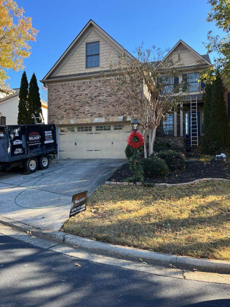 Garage Door and Home Exterior Painting and Rotten Wood Replacement in Marietta, GA by Nelson Exteriors