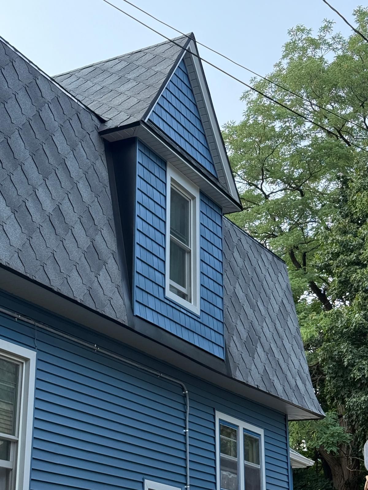 SIDING, DECK AND NEW PORCH  by Avalon Roofing and Exteriors