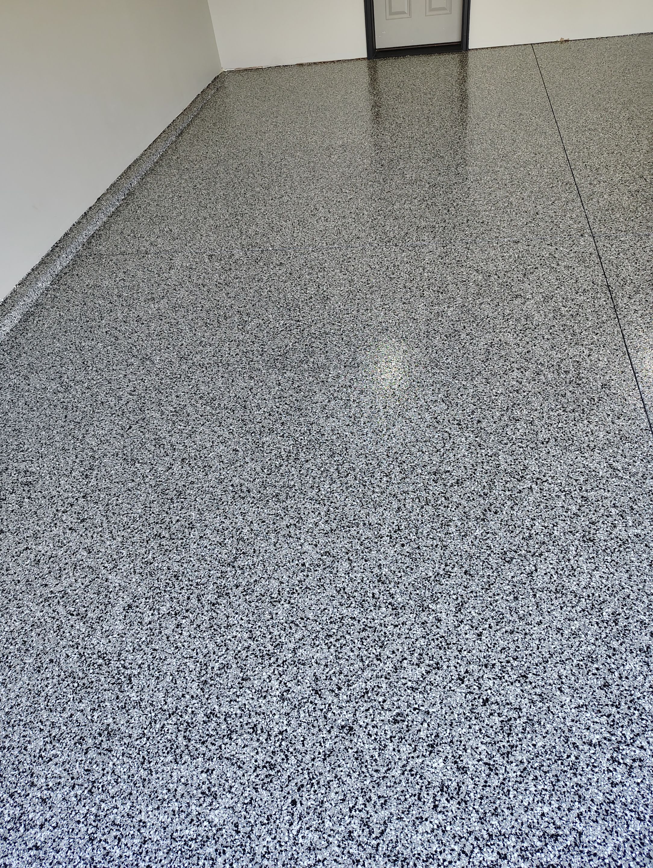 Custom Epoxy Garage Floor Coating Installation in Sioux Falls by Select Painting, Coatings & Garage Cabinets