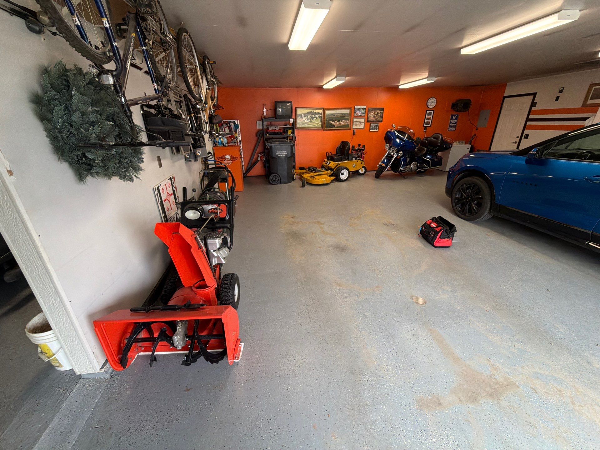 Custom Grey Flake Epoxy Garage Floor Installation in Remsen by Select Painting, Coatings & Garage Cabinets