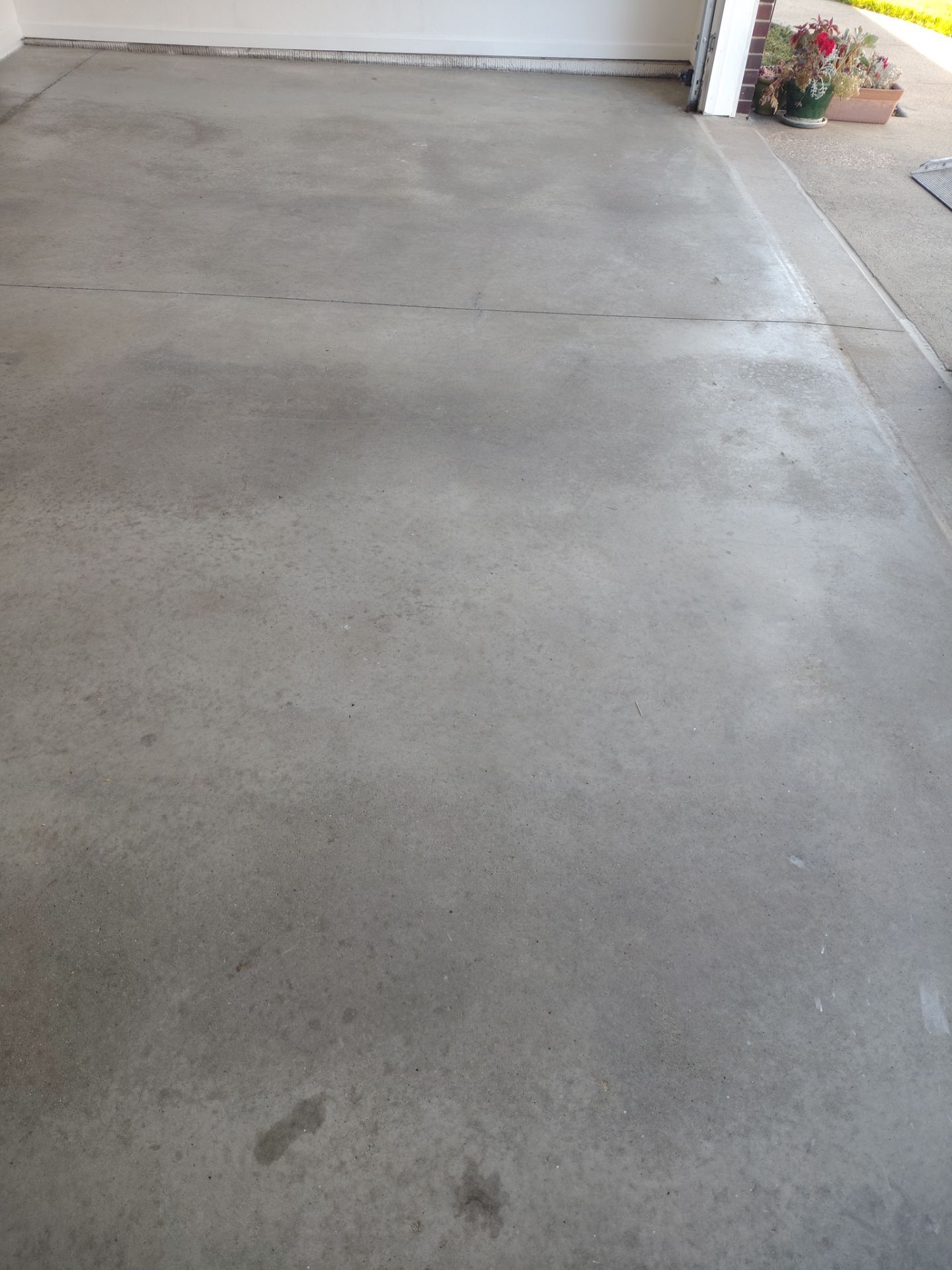 New Johnston Garage Resurfacing by Revival Concrete Coatings, LLC