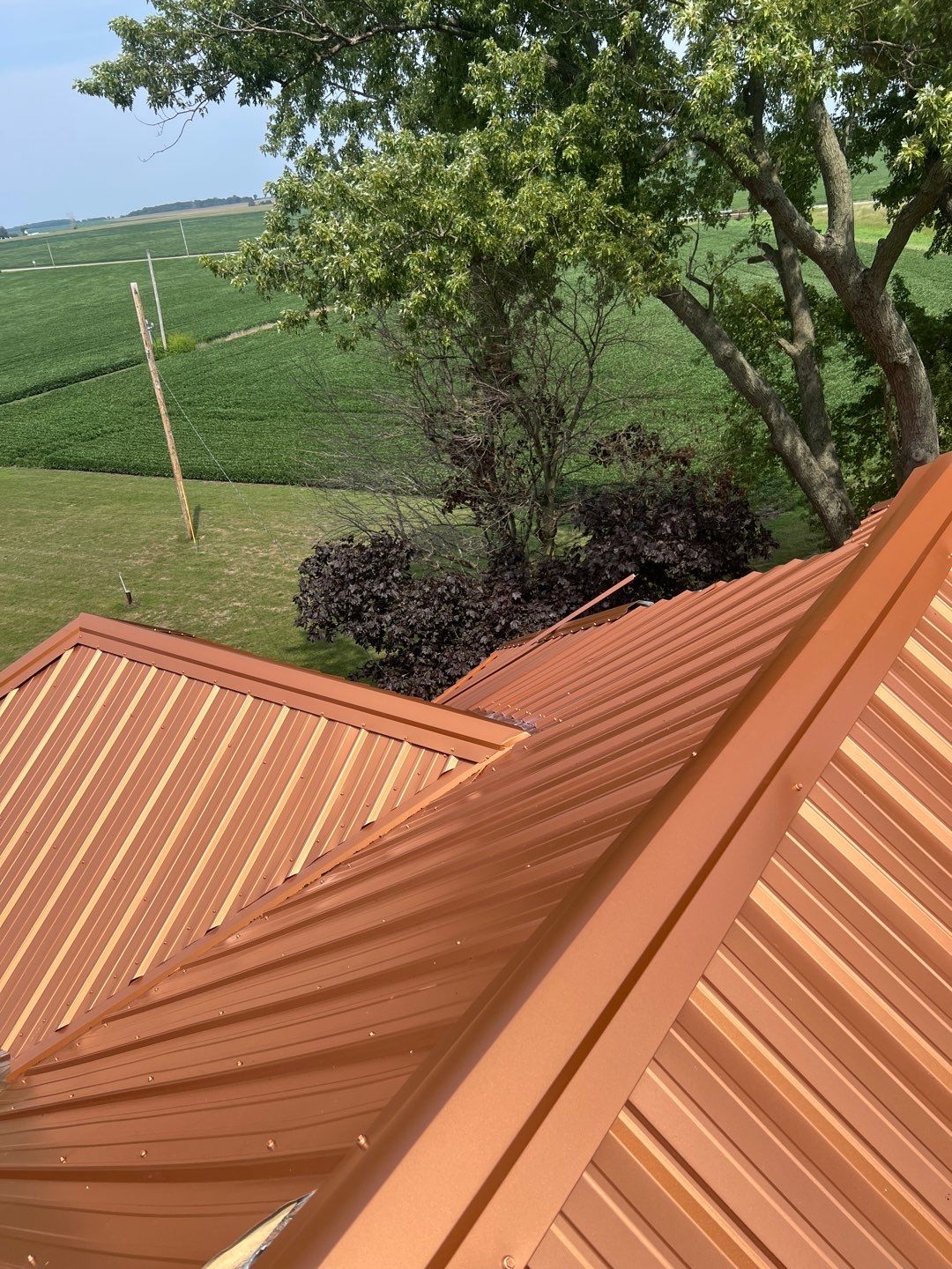 Residential Roofing Installation using Performance Panel Metal - Copper Metallic by RoofX 