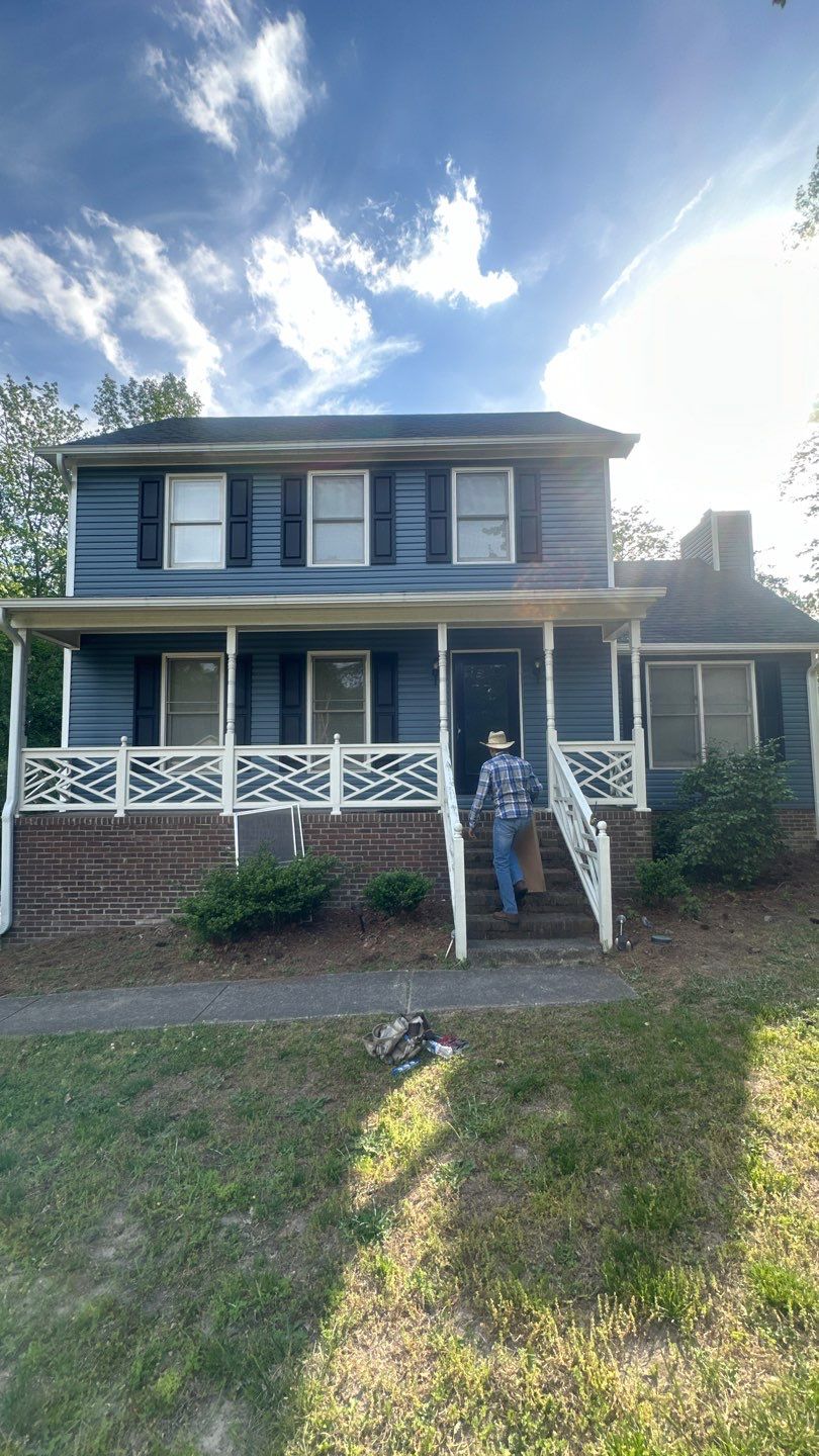 Blue Vinyl Siding Replacement and Exterior Trim Update in Durham by The Remodeling Company