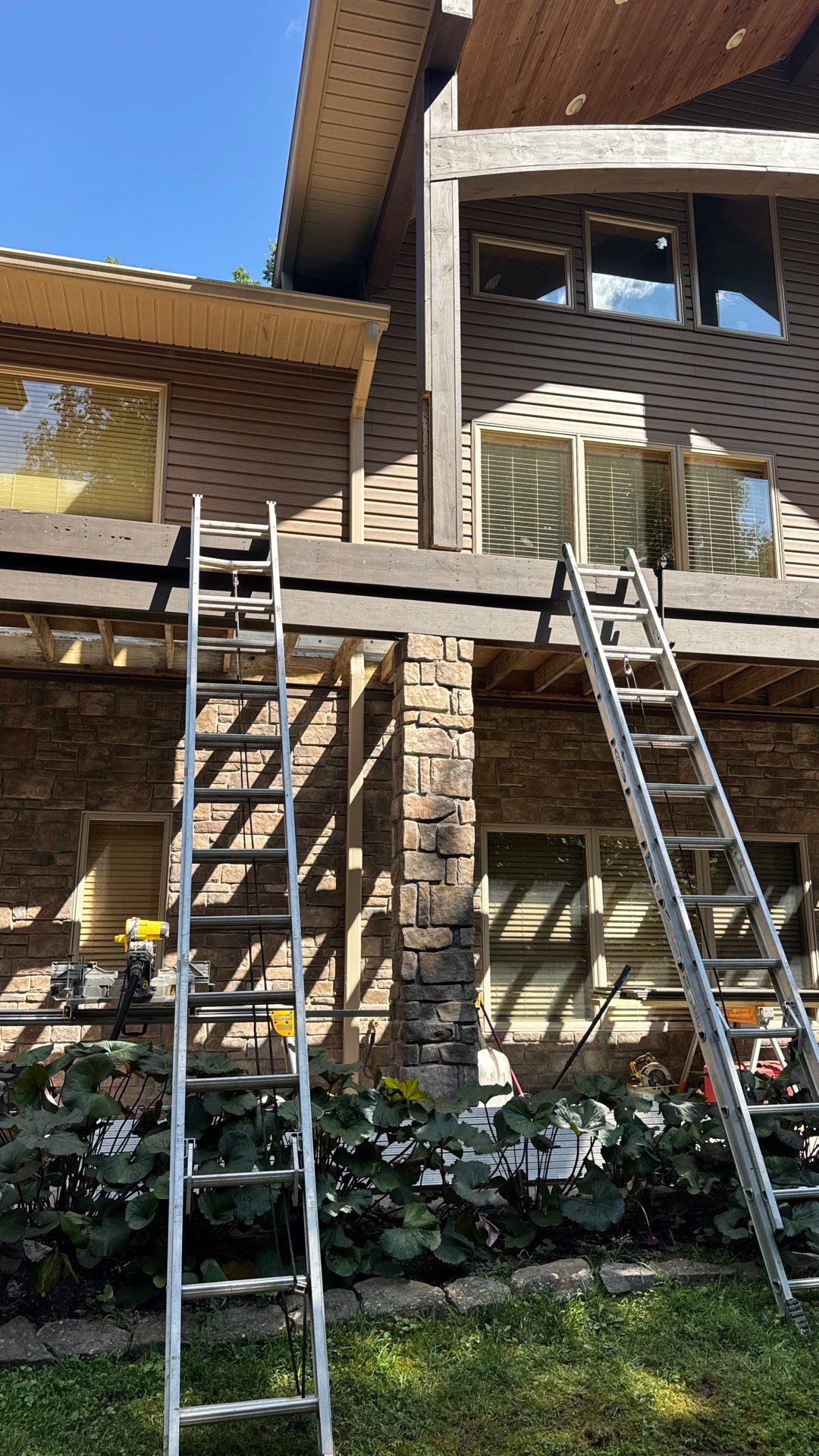 Custom Composite Deck Construction with Stone Pillars in Fayetteville by Walnut Hollow Decks & Outdoor Living