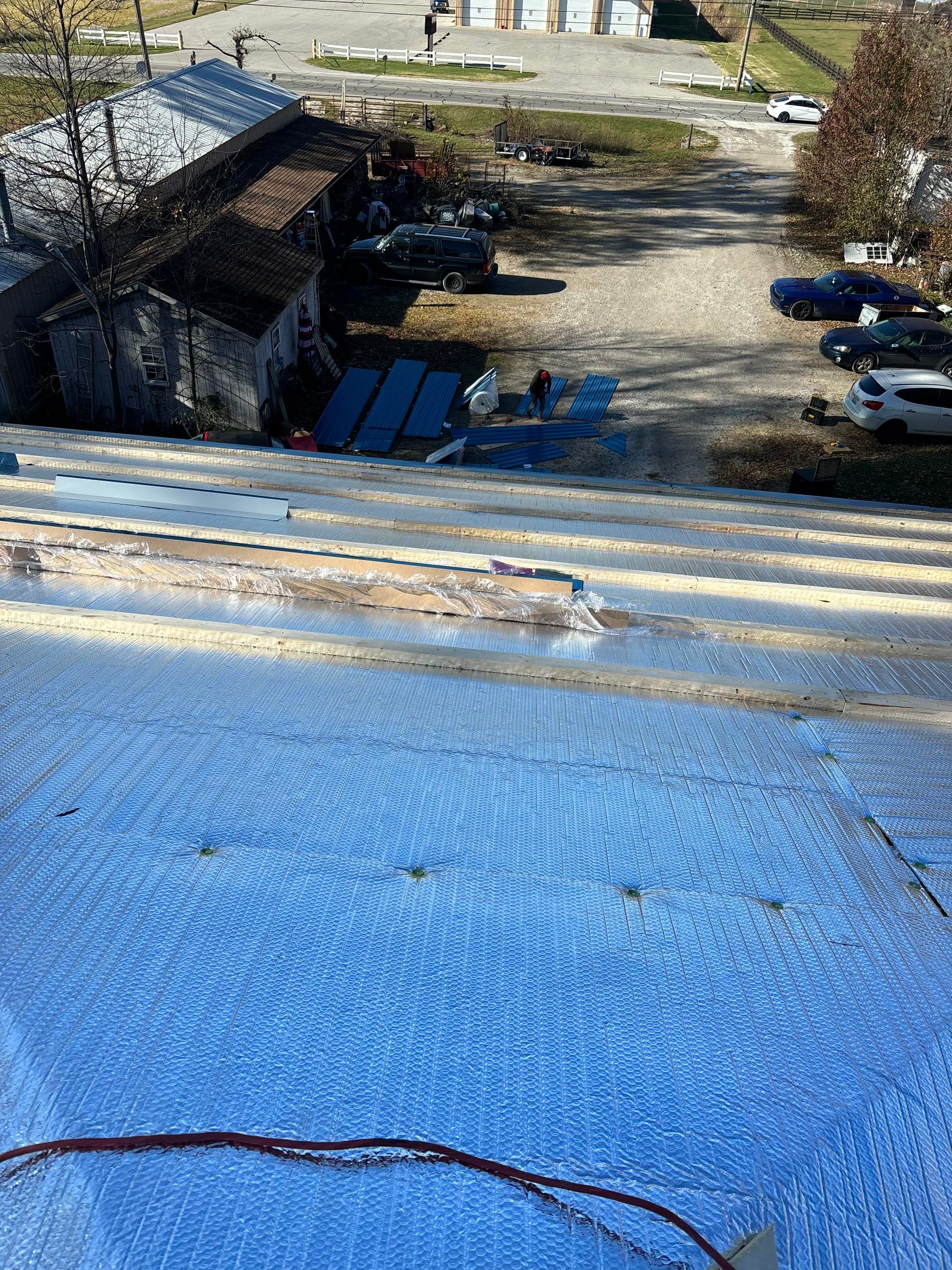 Residential Roofing Installation using Custom Metal and insulation by Storm Contracting 