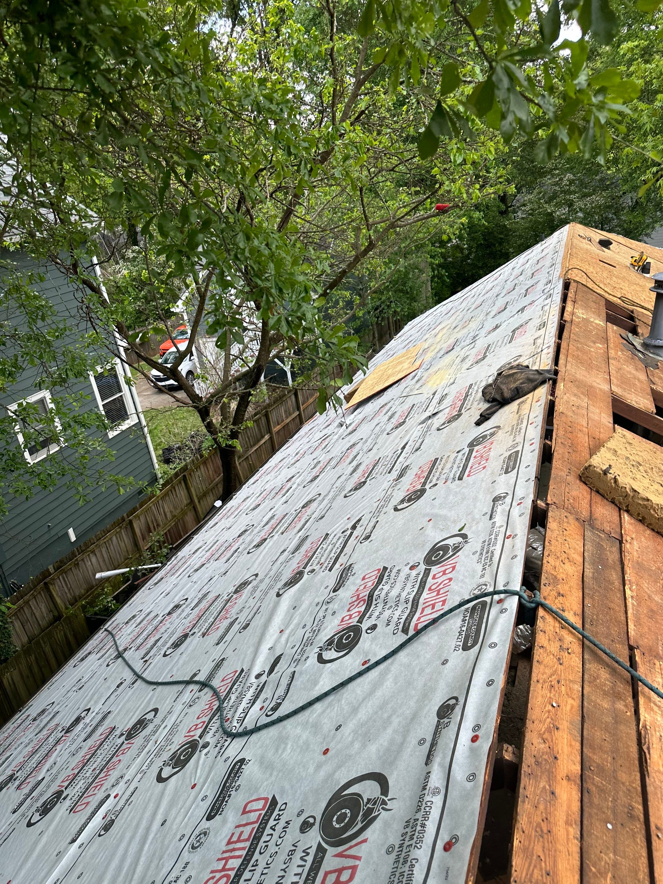 roof replacement and new black gutters by Nailed It Roofing & Remodeling LLC