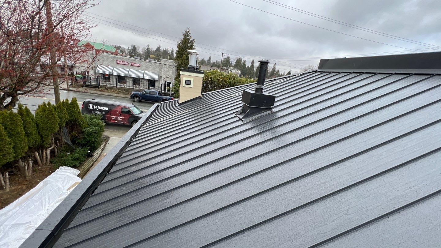 Commercial Roofing Installation using 12" Prolok metal and hidden gutters! by Top Notch Roofing Inc