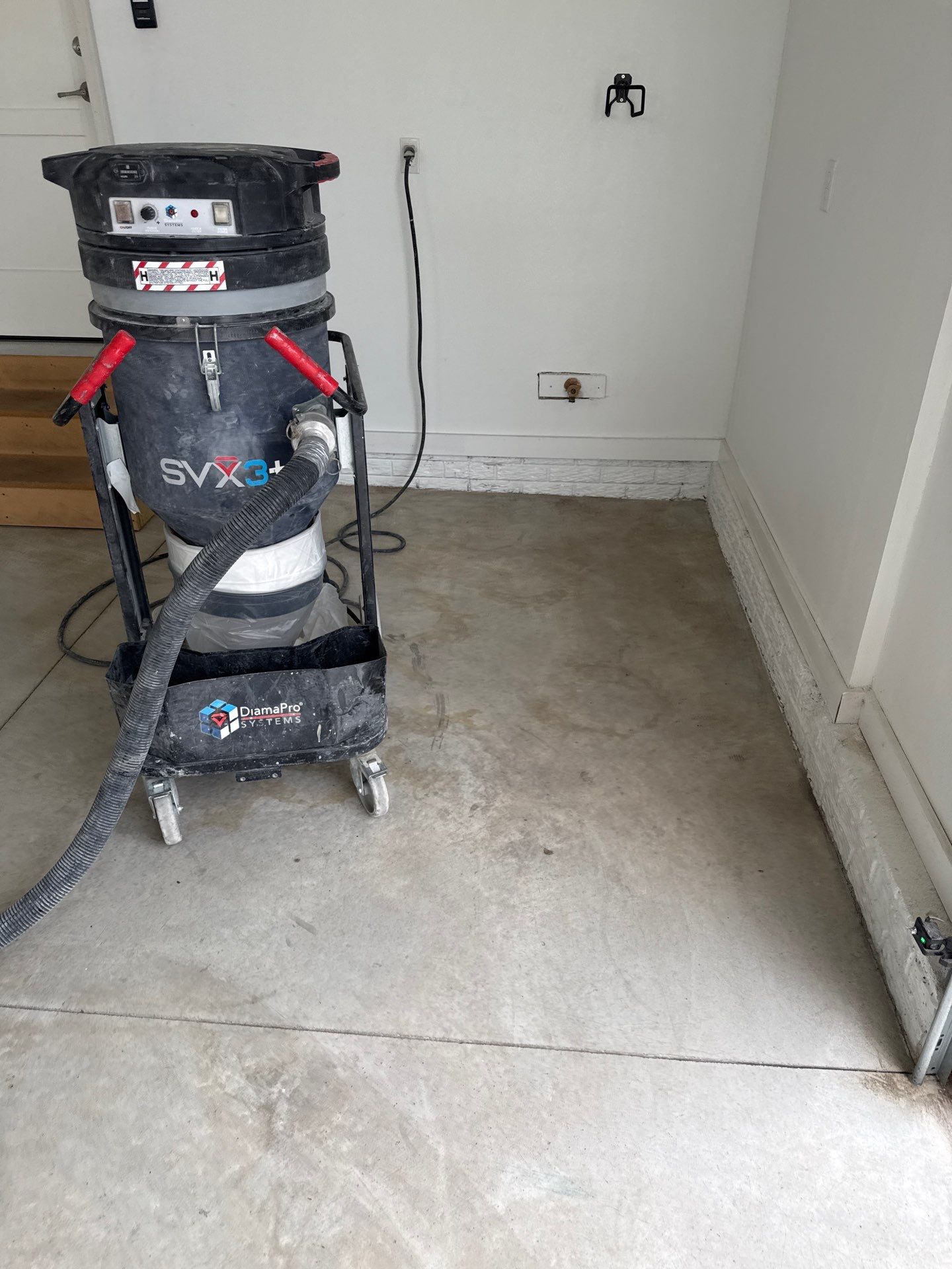 Gravel Flake Garage and Patio Floor Coating for Boone Residence by Revival Concrete Coatings