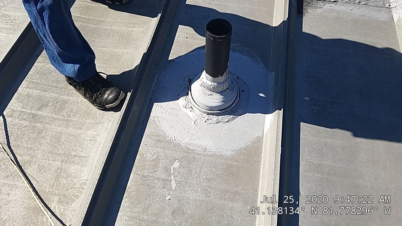 Commercial Metal Roof Coating by Gold Star Roofing LLC