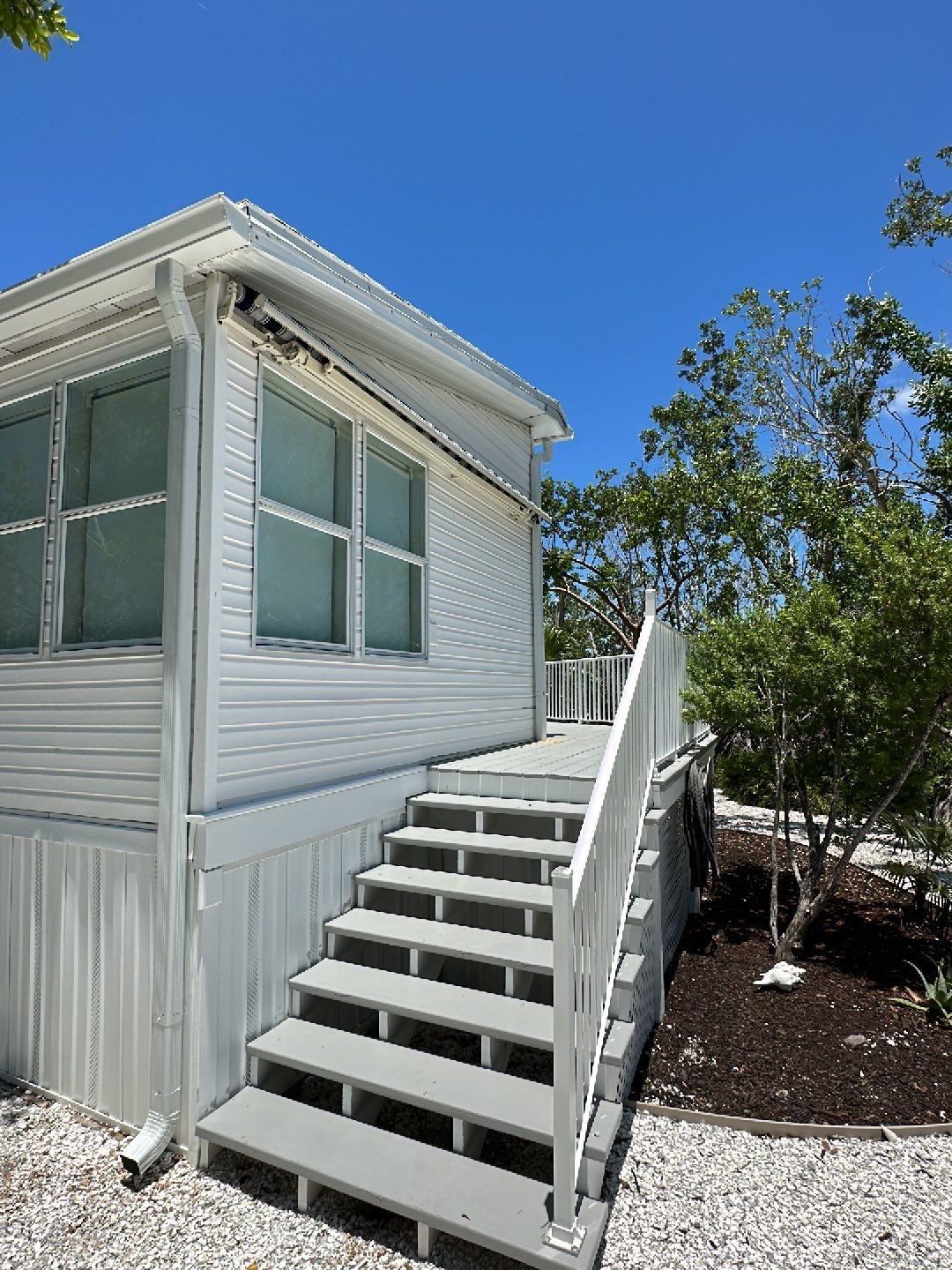 Downspout Installation using Charcoal Grey in Sanibel FL by Gutter Professors