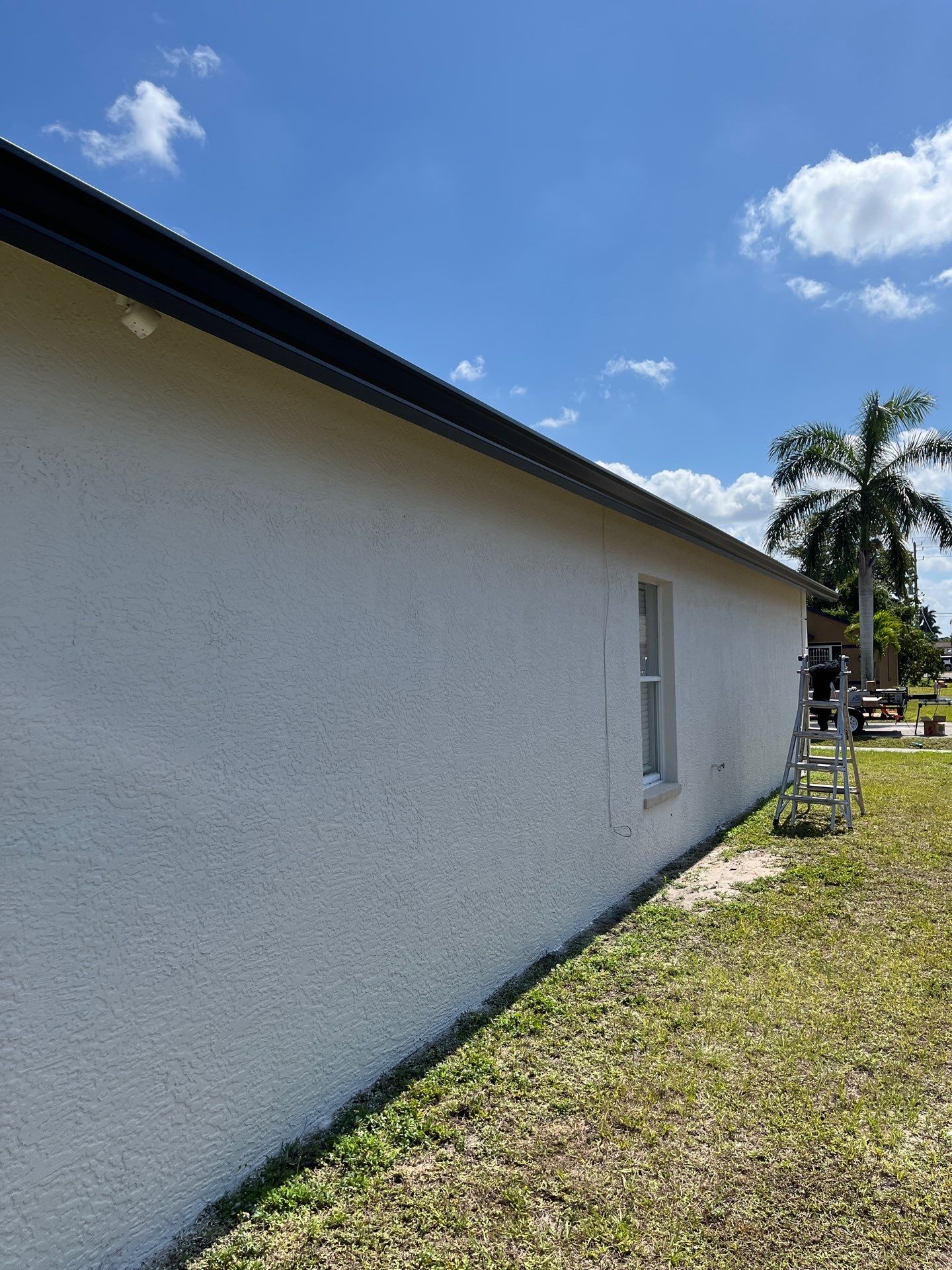 Black Seamless Gutters and Downspouts in Fort Myers FL by Gutter Professors