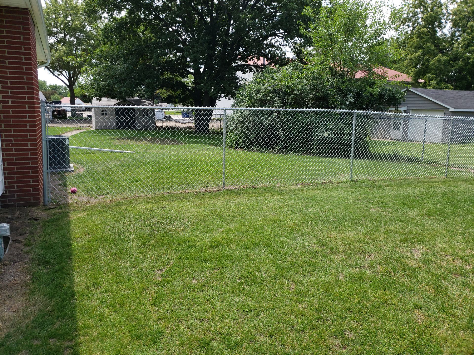 Residential Chain Link Fence and Gate Installation in Washburn by Perfect Picket Fence and Stain