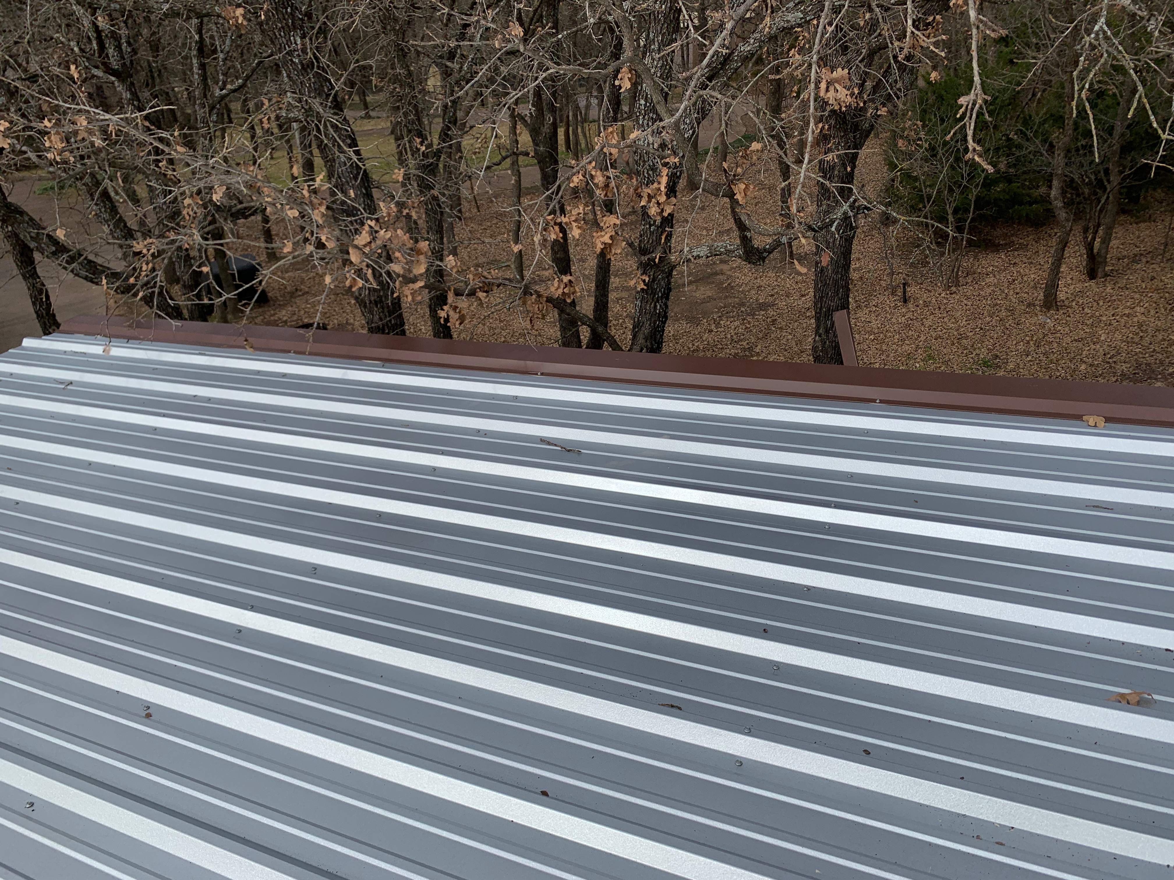 Install new R Panel Metal Roof at a Clients Farm house by First United Roofing & Construction