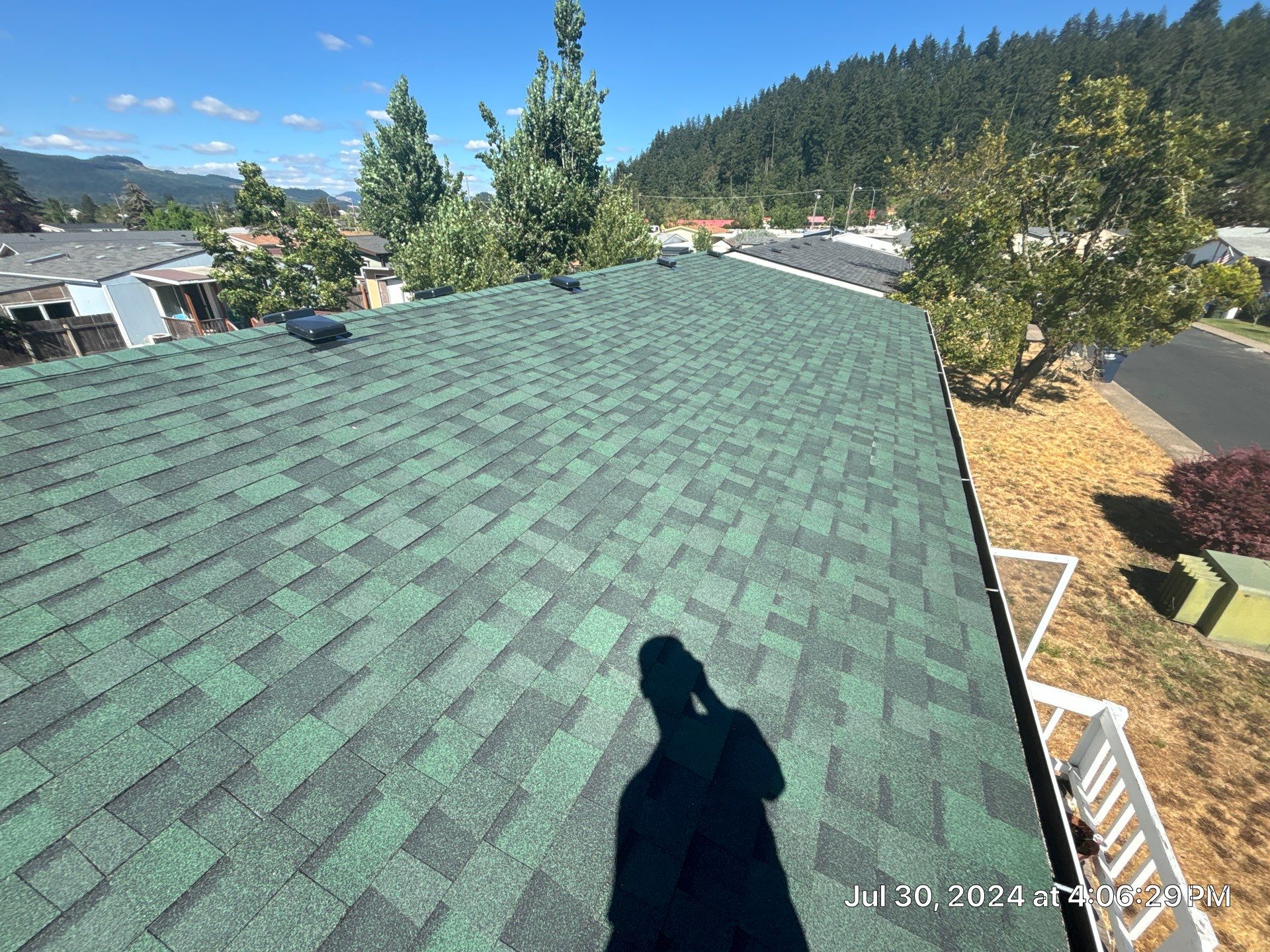 Residential Reroof using Owens Corning Duration Shingles in the color Chateau Green. by BEST Roofing & Waterproofing